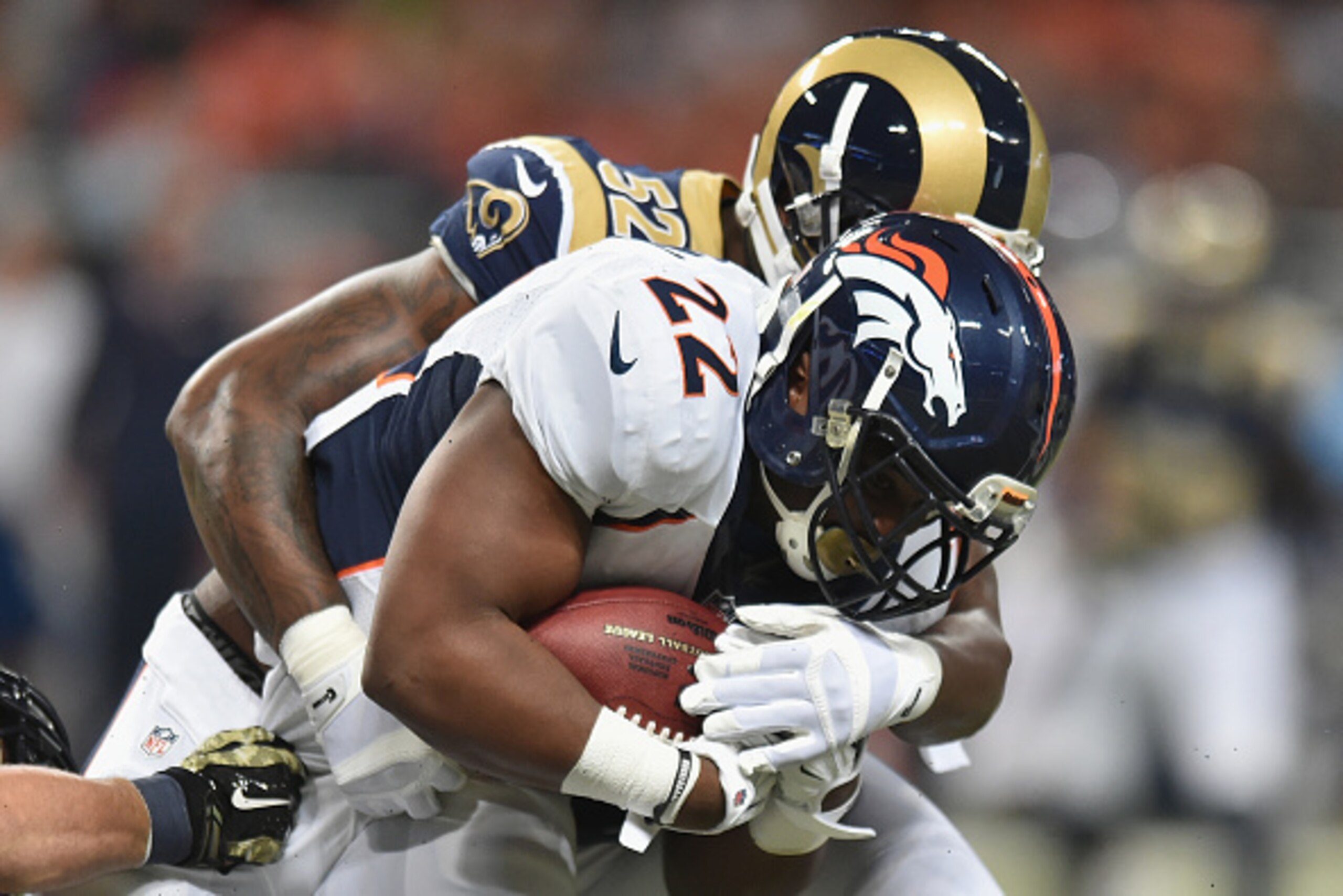 ST. LOUIS, MO - NOVEMBER 16: C.J. Anderson #22 of the Denver Broncos rushes against the St. Louis Rams in the in the first quarter at the Edward Jones Dome on November 16, 2014 in St. Louis, Missouri.  (Photo by Michael B. Thomas/Getty Images)
