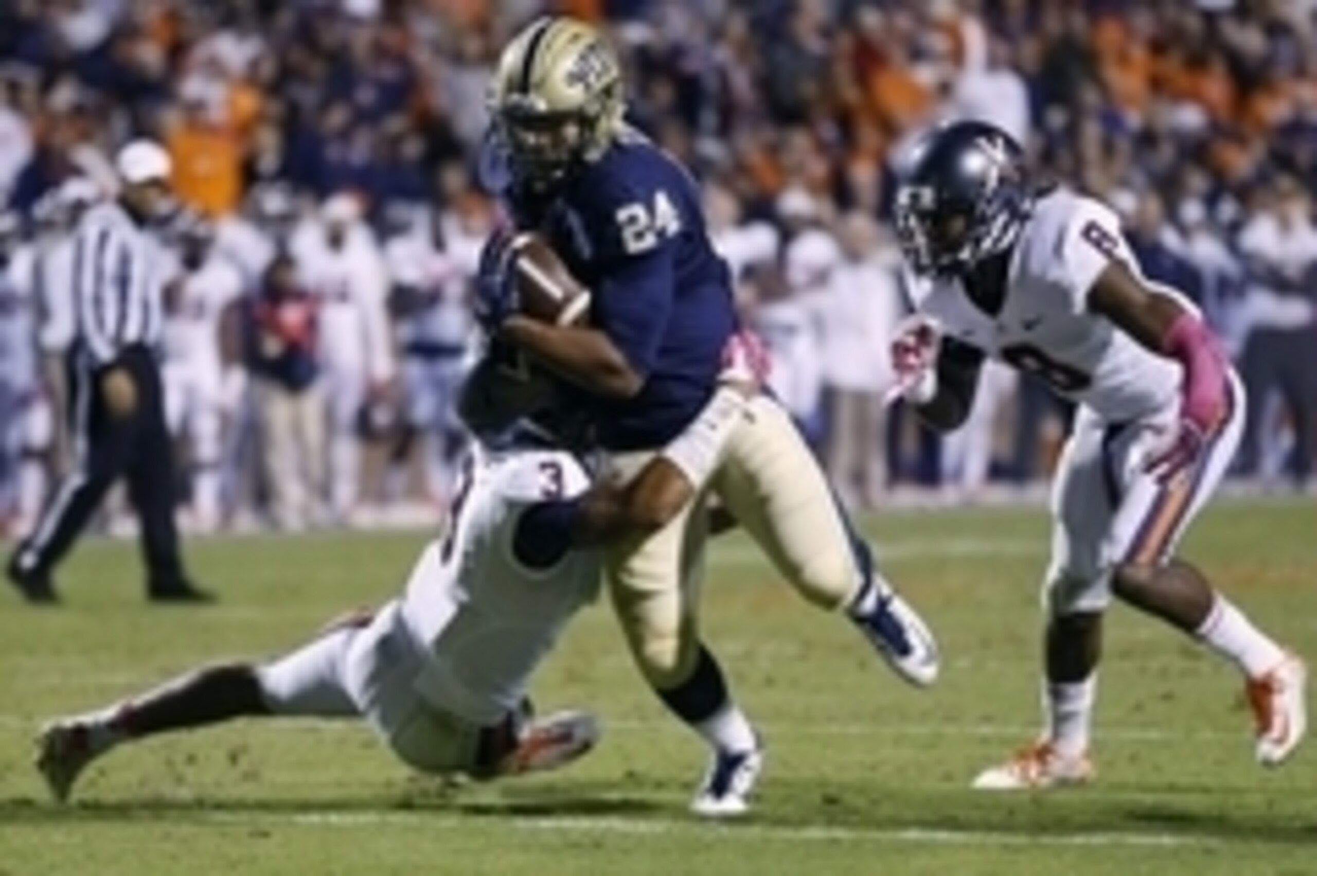 Oct 4, 2014; Charlottesville, VA, USA; Pittsburgh Panthers running back James Conner (24) carries the ball as Virginia Cavaliers safety Quin Blanding (3) makes the tackle in the third quarter at Scott Stadium. The Cavaliers won 24-19. Mandatory Credit: Ge