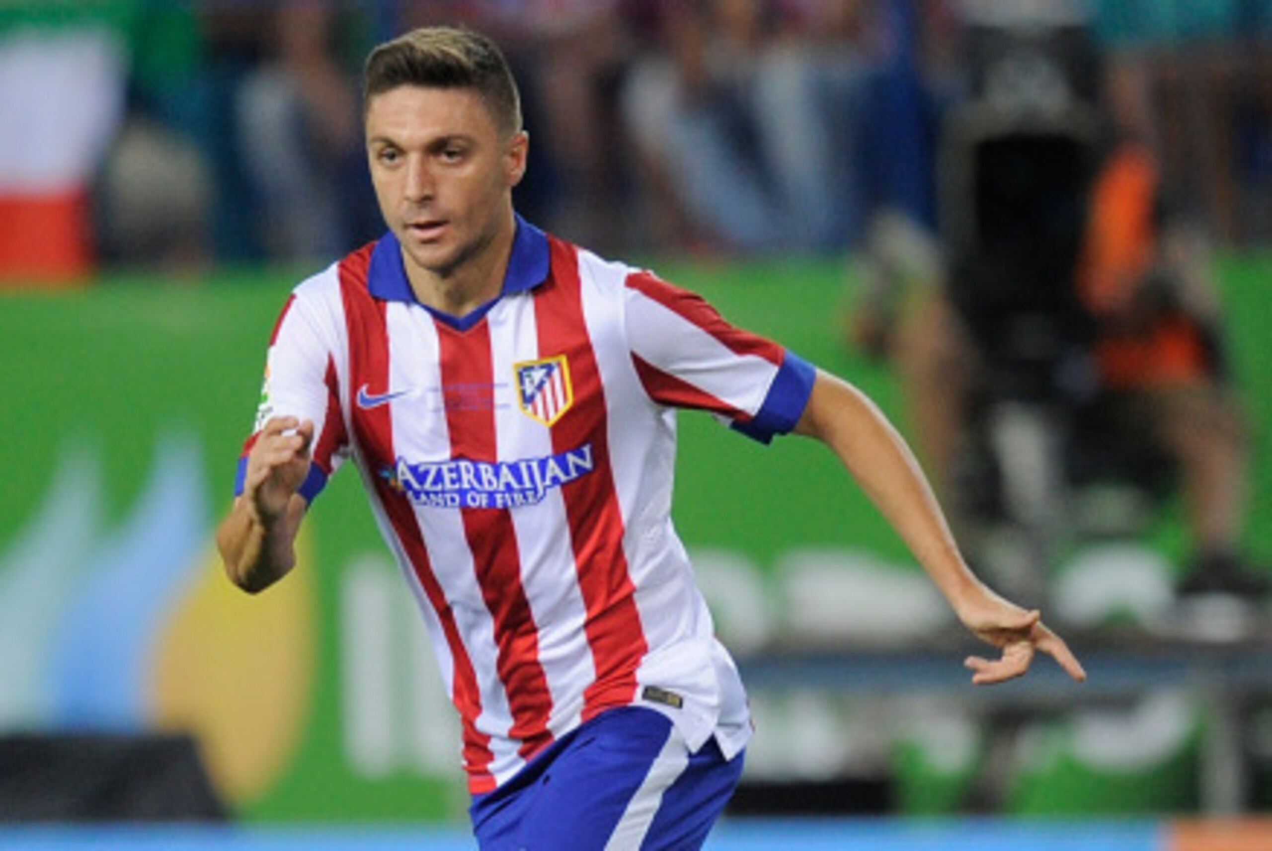 MADRID, SPAIN - AUGUST 22:  Guilherme Siqueira of Club Atletico de Madrid in action during the Supercopa, second leg match between Club Atletico de Madrid and Real Madrid at Vicente Caldron stadium on August 22, 2014 in Madrid, Spain.  (Photo by Denis Doy