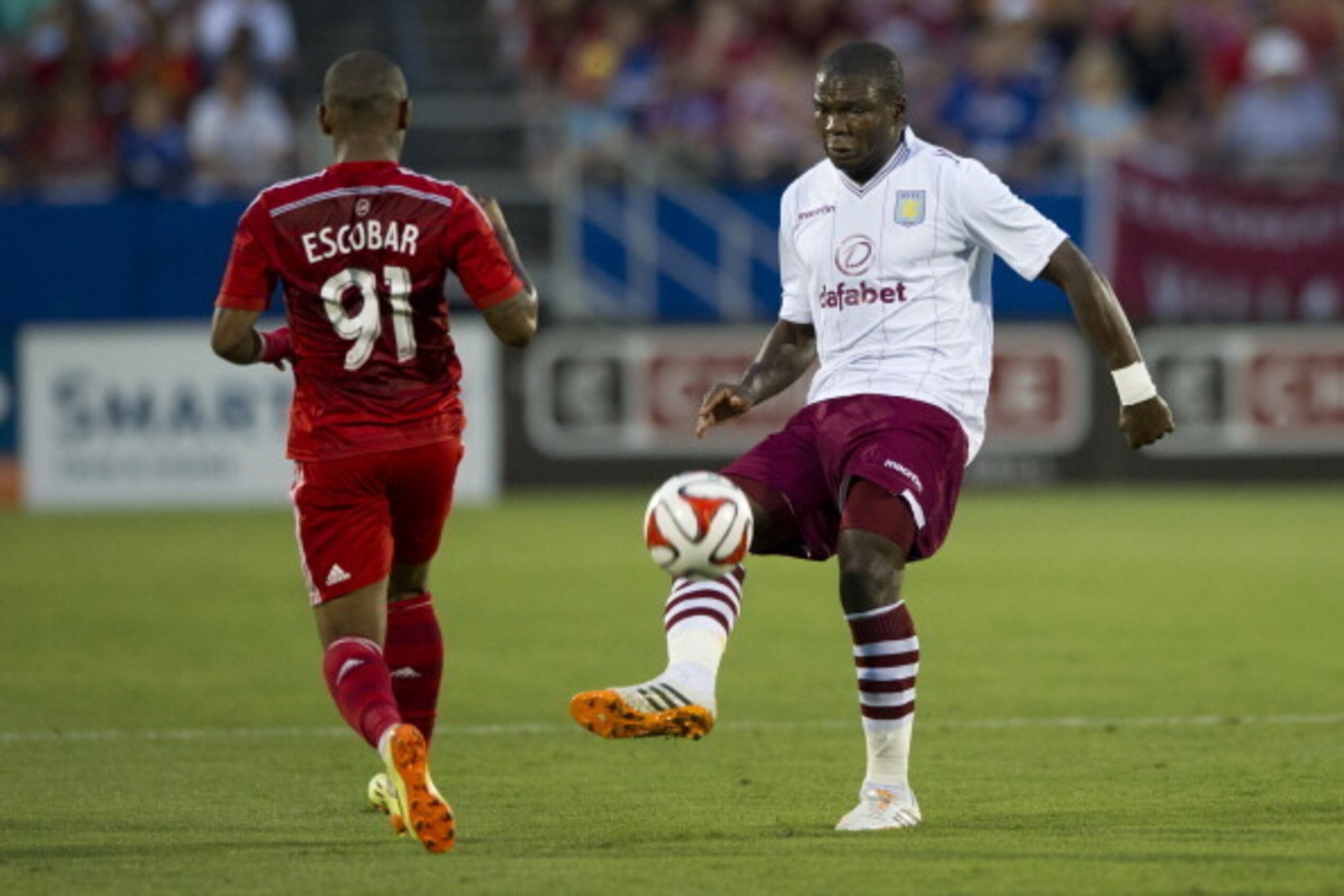 FRISCO, TX - JULY 23:  Jores Okore #5 of Aston Villa controls the ball against FC Dallas during an international friendly on July 23, 2014 at Toyota Stadium in Frisco, Texas.  (Photo by Cooper Neill/Getty Images)