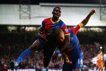 LONDON, ENGLAND - MAY 05:  Dwight Gayle #16 (R) of Crystal Palace celebrates with teammate Yannick Bolasie after scoring his team's third goal to level the scores at 3-3 during the Barclays Premier League match between Crystal Palace and Liverpool at Selh