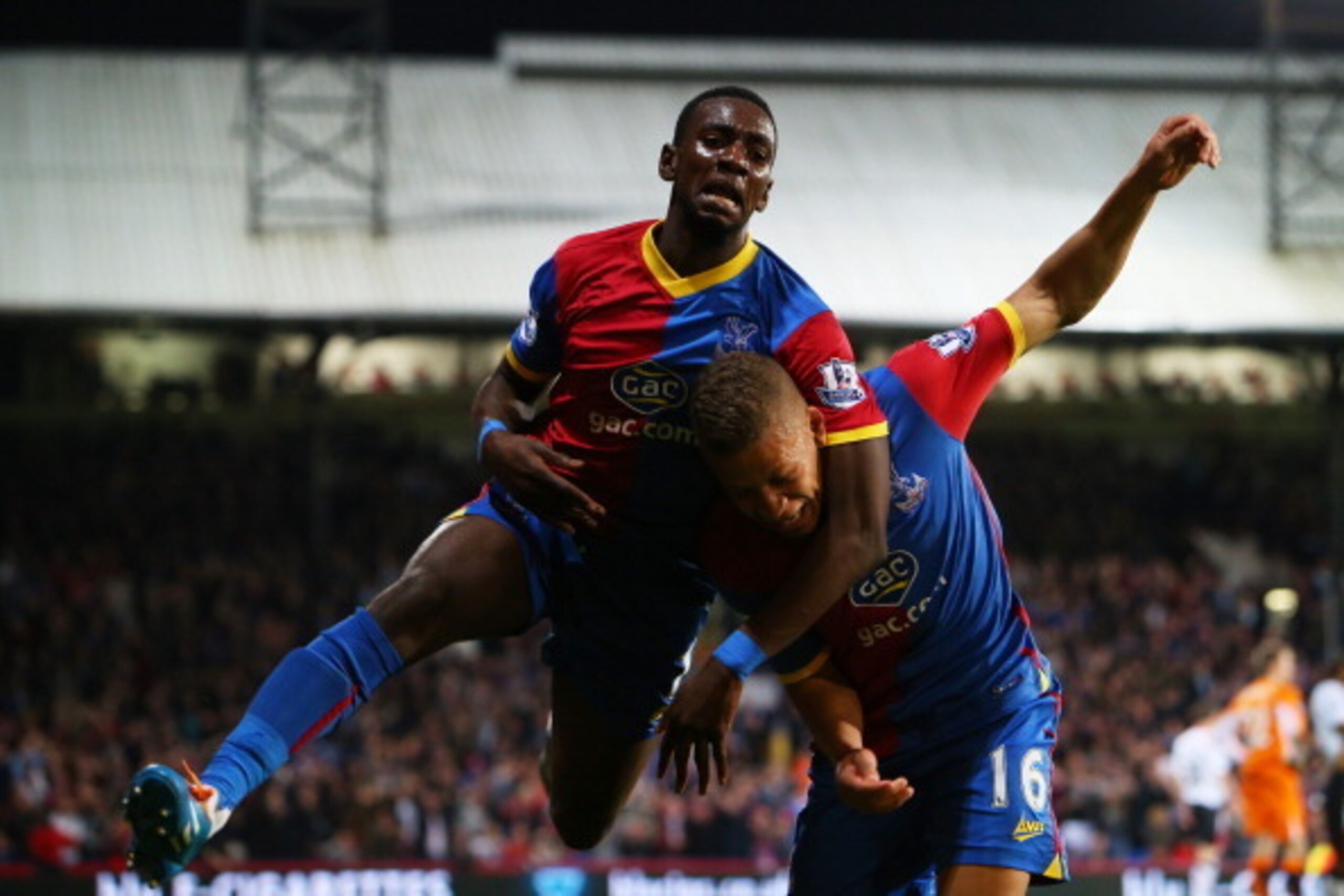 LONDON, ENGLAND - MAY 05: Dwight Gayle #16 (R) of Crystal Palace celebrates with teammate Yannick Bolasie after scoring his team's third goal to level the scores at 3-3 during the Barclays Premier League match between Crystal Palace and Liverpool at Selh LONDON, ENGLAND - MAY 05: Dwight Gayle #16 (R) of Crystal Palace celebrates with teammate Yannick Bolasie after scoring his team's third goal to level the scores at 3-3 during the Barclays Premier League match between Crystal Palace and Liverpool at Selh