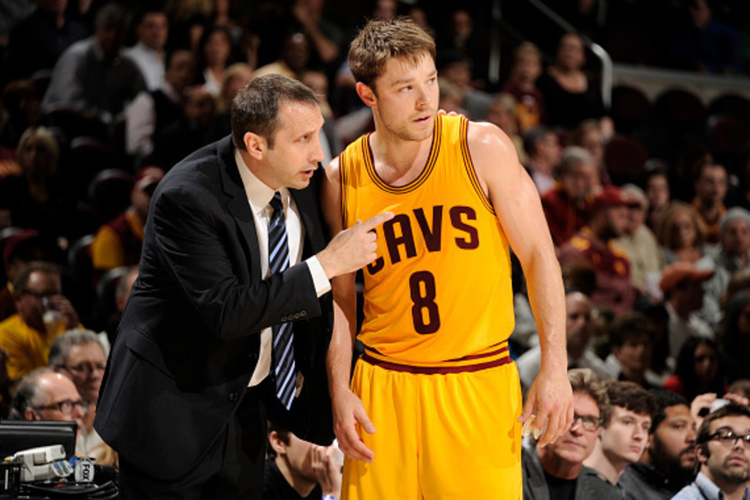 CLEVELAND, OH - OCTOBER 14:  Head coach David Blatt of the Cleveland Cavaliers talks with Matthew Dellavedova #8 during a break in the action against the Milwaukee Bucks at The Quicken Loans Arena on October 14, 2014 in Cleveland, Ohio. NOTE TO USER: User