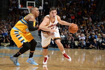 DENVER, CO - NOVEMBER 7:  Joe Harris #12 of the Cleveland Cavaliers drives to the basket against the Denver Nuggets on November 7, 2014 at the Pepsi Center in Denver, Colorado. NOTE TO USER: User expressly acknowledges and agrees that, by downloading and 