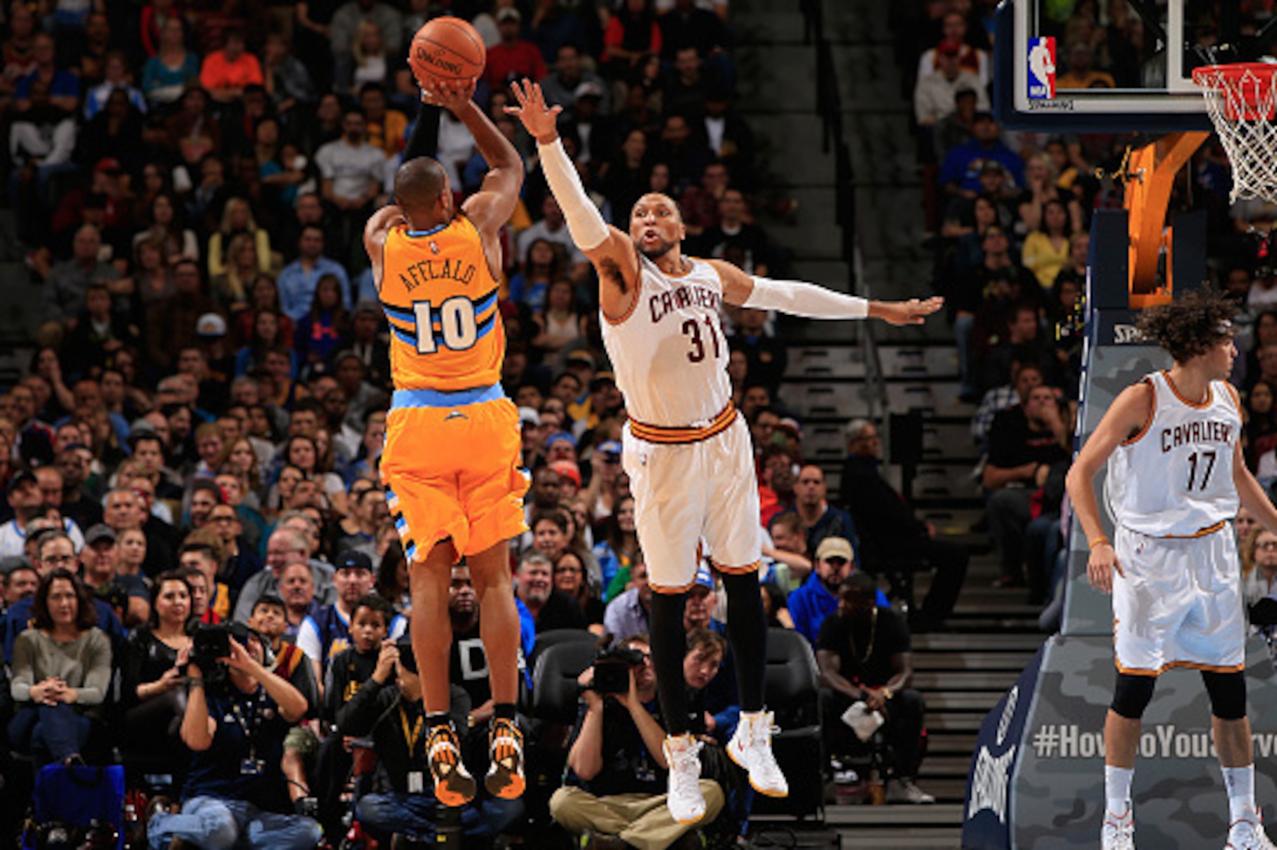 DENVER, CO - NOVEMBER 07:  Arron Afflalo #10 of the Denver Nuggets takes a shot against Shawn Marion #31 of the Cleveland Cavaliers at Pepsi Center on November 7, 2014 in Denver, Colorado. The Cavaliers defeated the Nuggets 110-101. NOTE TO USER: User exp