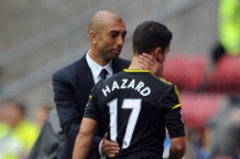 WIGAN, ENGLAND - AUGUST 19:  Chelsea manager Roberto Di Matteo embraces Eden Hazard as he leaves the field after being substituted during the Barclays Premier League match between Wigan Athletic and Chelsea at DW Stadium on August 19, 2012 in Wigan, Engla