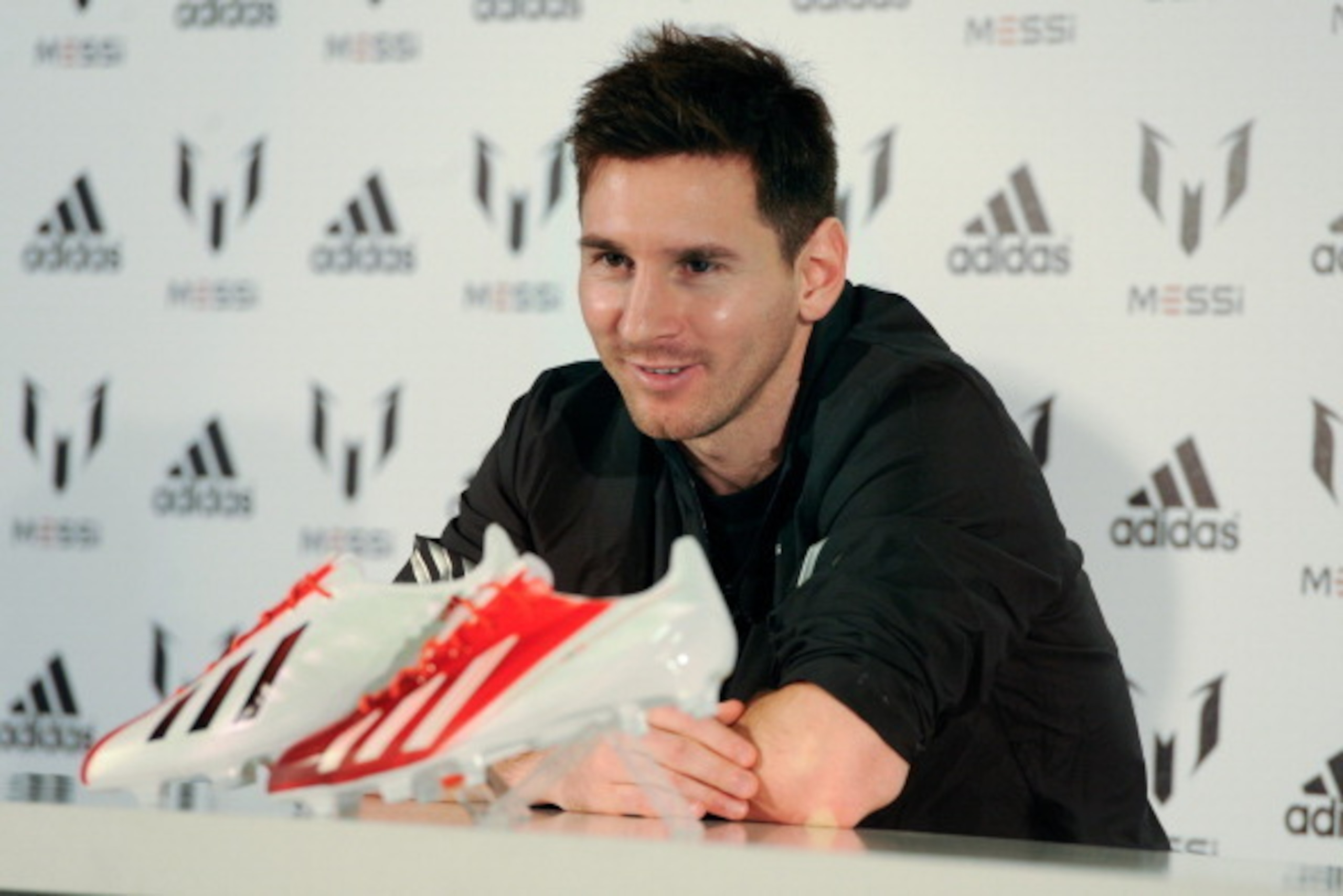 BARCELONA, SPAIN - MARCH 06:  Leo Messi speaks at adidas press conference to mark the launch of the Messi Gallery by adidas and the new adizero f50 Messi boot on March 6, 2013 in Barcelona, Spain.  (Photo by David Ramos/Getty Images for adidas)