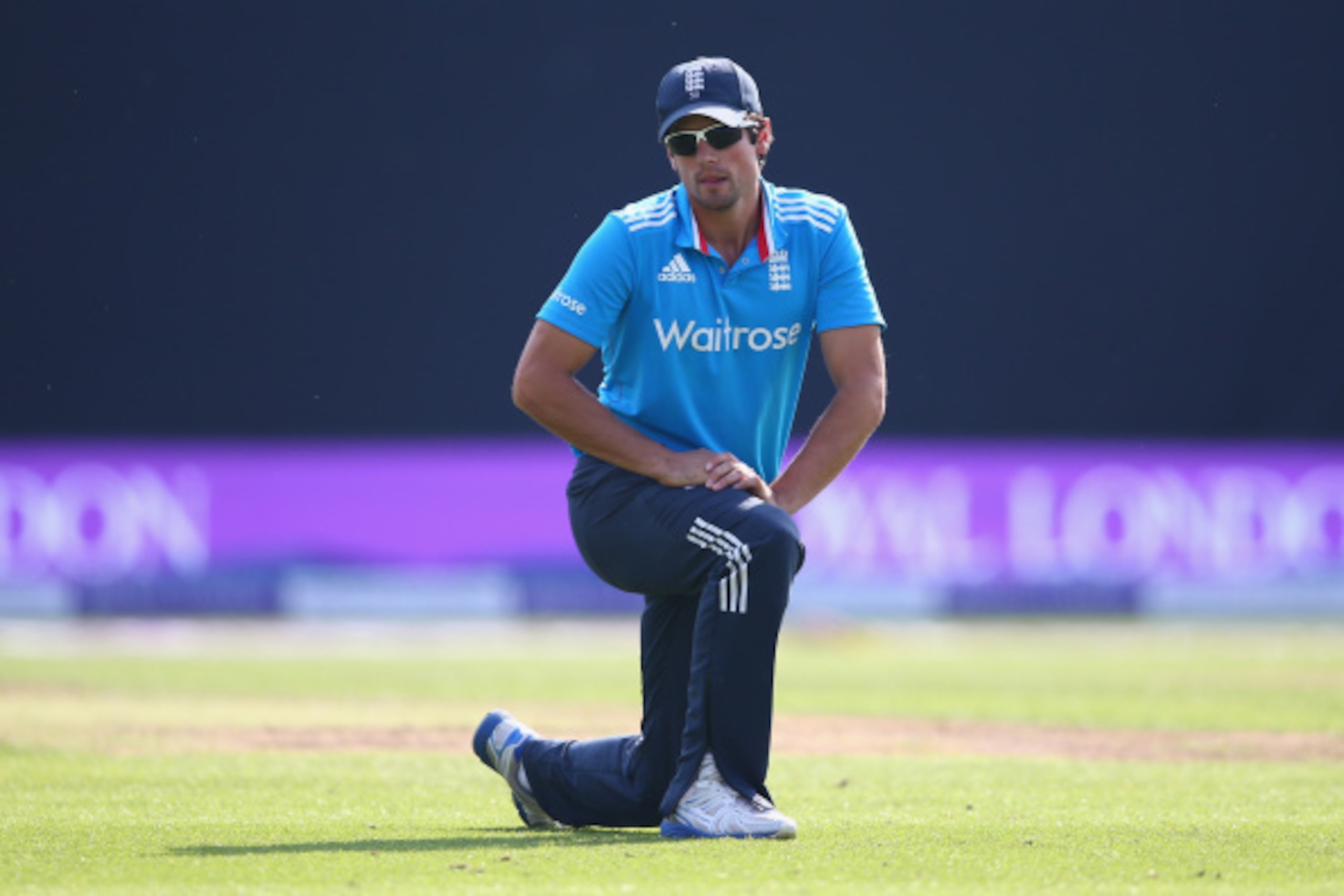 BIRMINGHAM, ENGLAND - SEPTEMBER 02:  Alastair Cook the captain of England on his knees as the opening batting pair of Shikhar Dhawan and Ajinkya Rahane of India pile the runs on during the fourth Royal London One-Day Series match between England and India