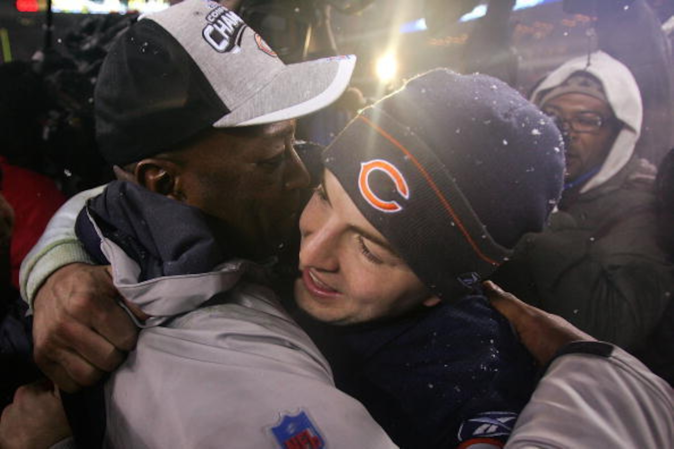 CHICAGO - JANUARY 21:  Quarterback Rex Grossman #8 of the Chicago Bears hugs head coach Lovie Smith after the Bears 39-14 win against the New Orleans Saints during the NFC Championship Game January 21, 2007 at Soldier Field in Chicago, Illinois.  (Photo b