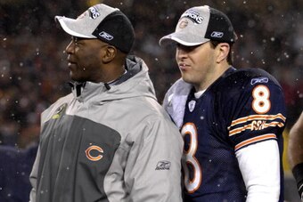Chicago Bears coach Lovie Smith and quarterback Rex Grossman in the snow during the NFC Championship game at Soldier Field in Chicago, Illinois on January 21, 2007.  (Photo by Al Messerschmidt/Getty Images)