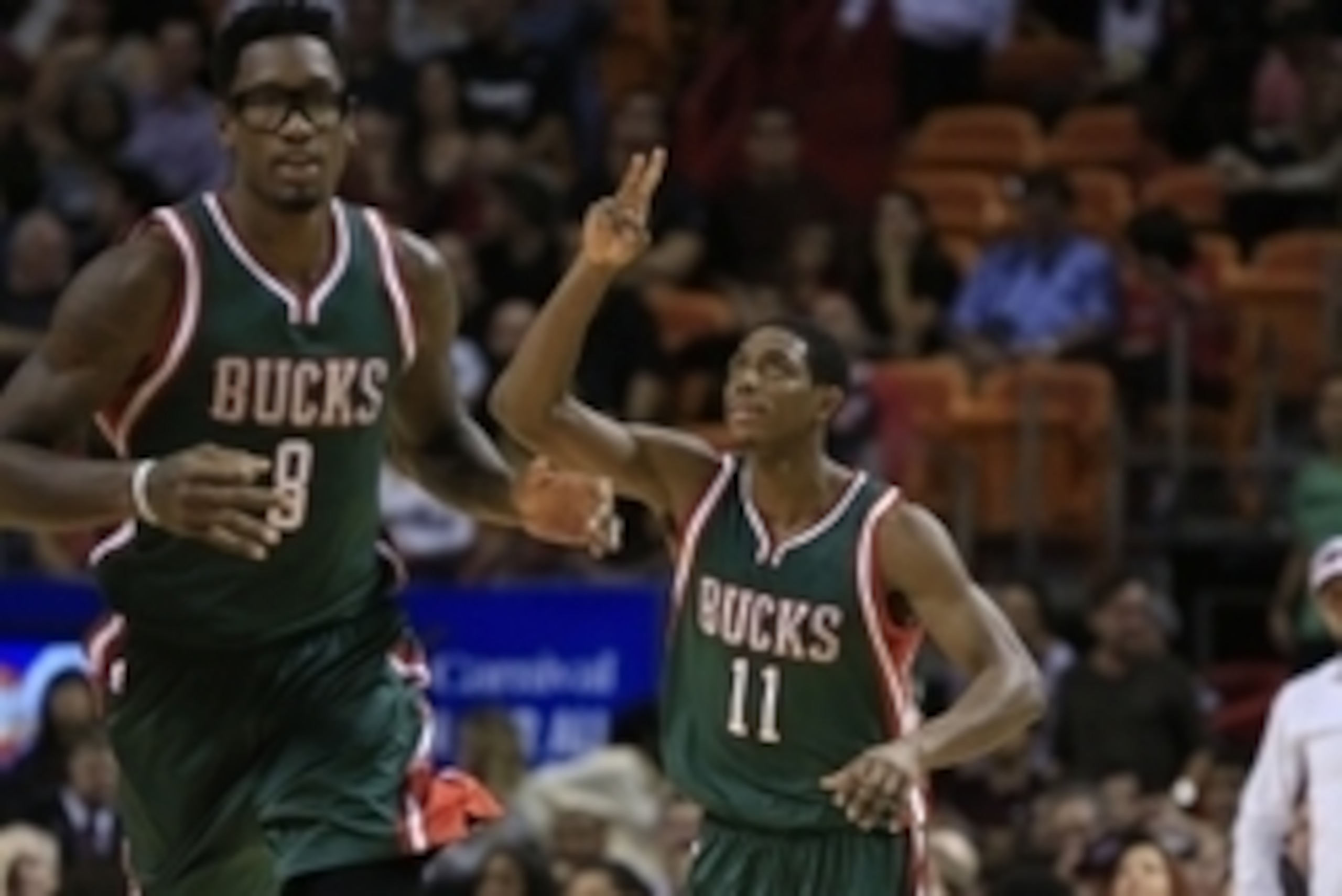 Nov 16, 2014; Miami, FL, USA;   Milwaukee Bucks guard Brandon Knight (11) reacts after making a  three point shot as center Larry Sanders (8) runs up court against the Miami Heat in the second half at American Airlines Arena. Mandatory Credit: Robert Maye