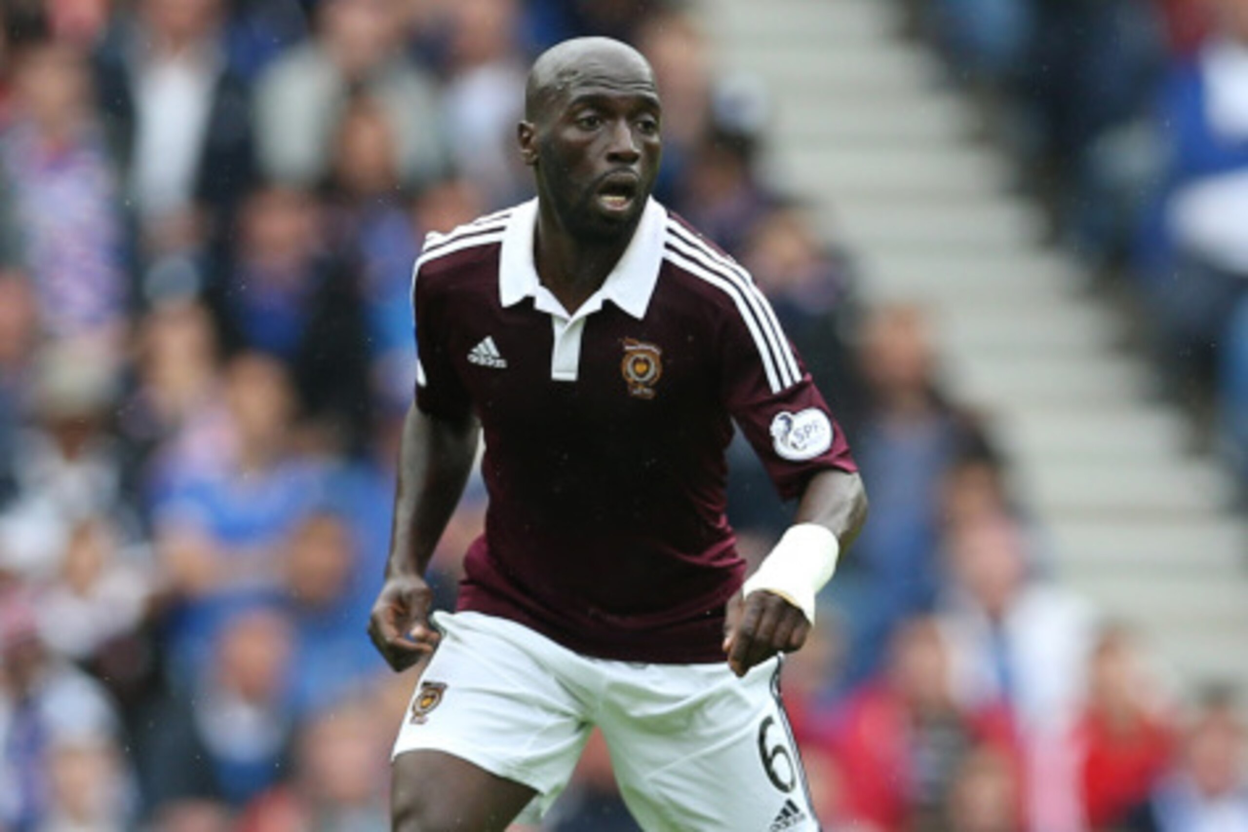 GLASGOW, SCOTLAND - AUGUST 10:  Morgaro Gomis of Hearts controls the ball during the Scottish Championship Opening League Match between Rangers and Hearts, at Ibrox Stadium on August 10, 2014 Glasgow, Scotland. (Photo by Ian MacNicol/Getty Images)