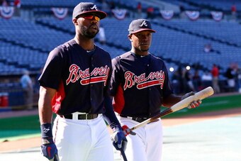 ATLANTA, GA - APRIL 01:  Jason Heyward #22 and Justin Upton #8 of the Atlanta Braves walk off the field after batting practice prior to facing the Philadelphia Phillies during opening day at Turner Field on April 1, 2013 in Atlanta, Georgia.  (Photo by Ke