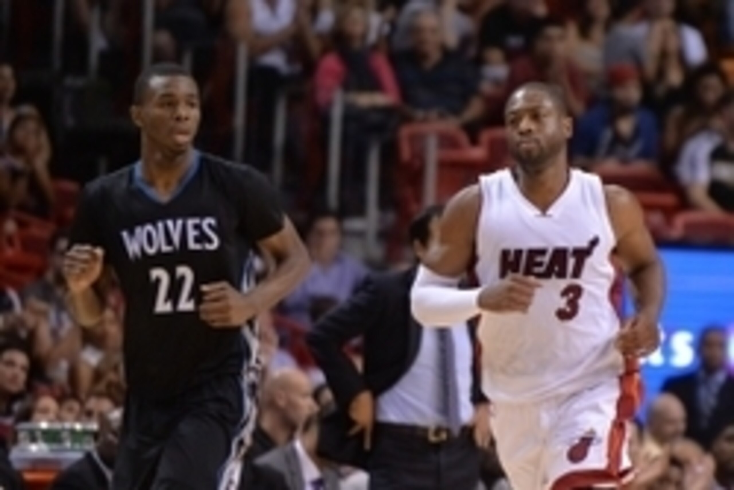 Nov 8, 2014; Miami, FL, USA; Miami Heat guard Dwyane Wade (3) and Minnesota Timberwolves forward Andrew Wiggins (22) during the second  half at American Airlines Arena. The Heat won 102-92.  Mandatory Credit: Steve Mitchell-USA TODAY Sports
