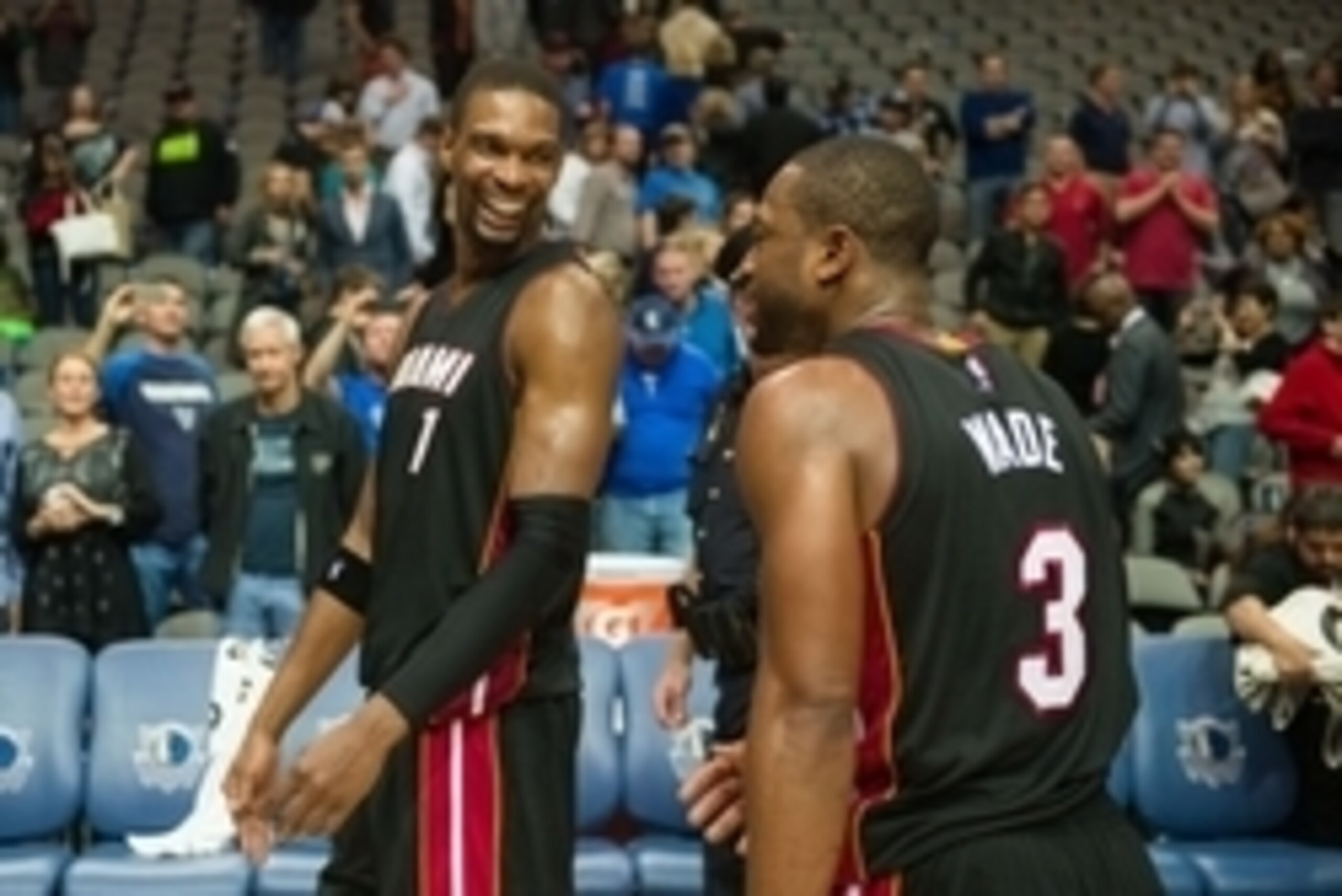 Nov 9, 2014; Dallas, TX, USA; Miami Heat center Chris Bosh (1) and guard Dwyane Wade (3) walk off the court after the game against the Dallas Mavericks at the American Airlines Center. The Heat defeated the Mavericks 105-96. Mandatory Credit: Jerome Miron