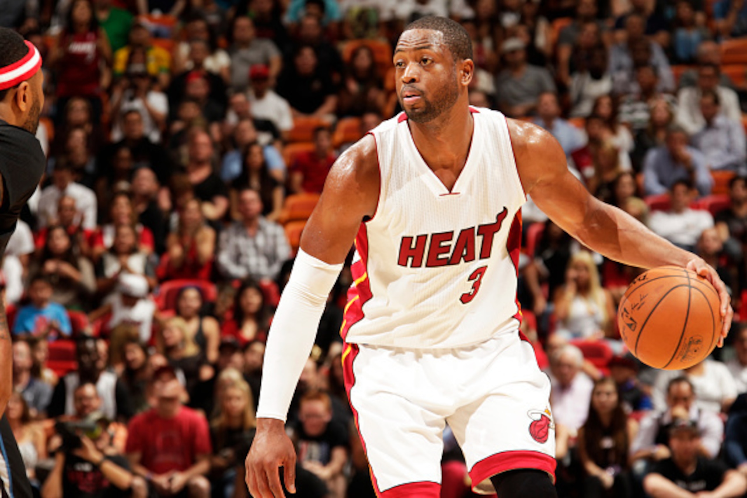 MIAMI, FL - November 8:  Dwyane Wade #3 of the Miami Heat handles the ball against the Minnesota Timberwolves at the American Airlines Arena in Miami, Florida on November 8, 2014. NOTE TO USER: User expressly acknowledges and agrees that, by downloading a
