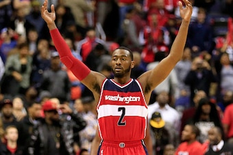 WASHINGTON, DC - NOVEMBER 21:  John Wall #2 of the Washington Wizards celebrates during the closing moments of the Wizards 91-78 win over the Cleveland Cavaliers at Verizon Center on November 21, 2014 in Washington, DC. NOTE TO USER: User expressly acknow