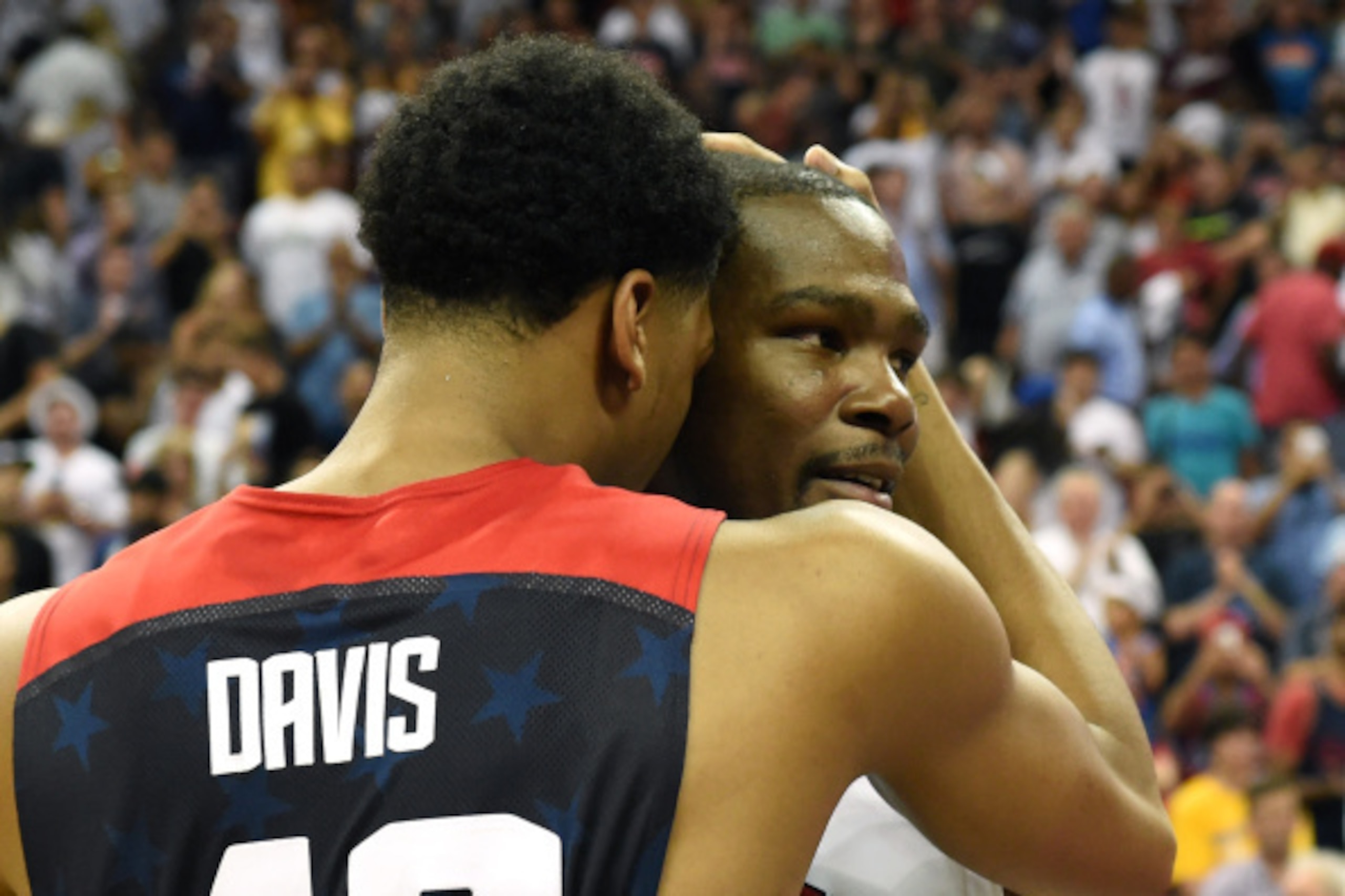 LAS VEGAS, NV - AUGUST 01:  Anthony Davis #42 and Kevin Durant #52 of the 2014 USA Basketball Men's National Team hug on the court after the game was called in the fourth quarter after an injury to Paul George during a USA Basketball showcase at the Thoma