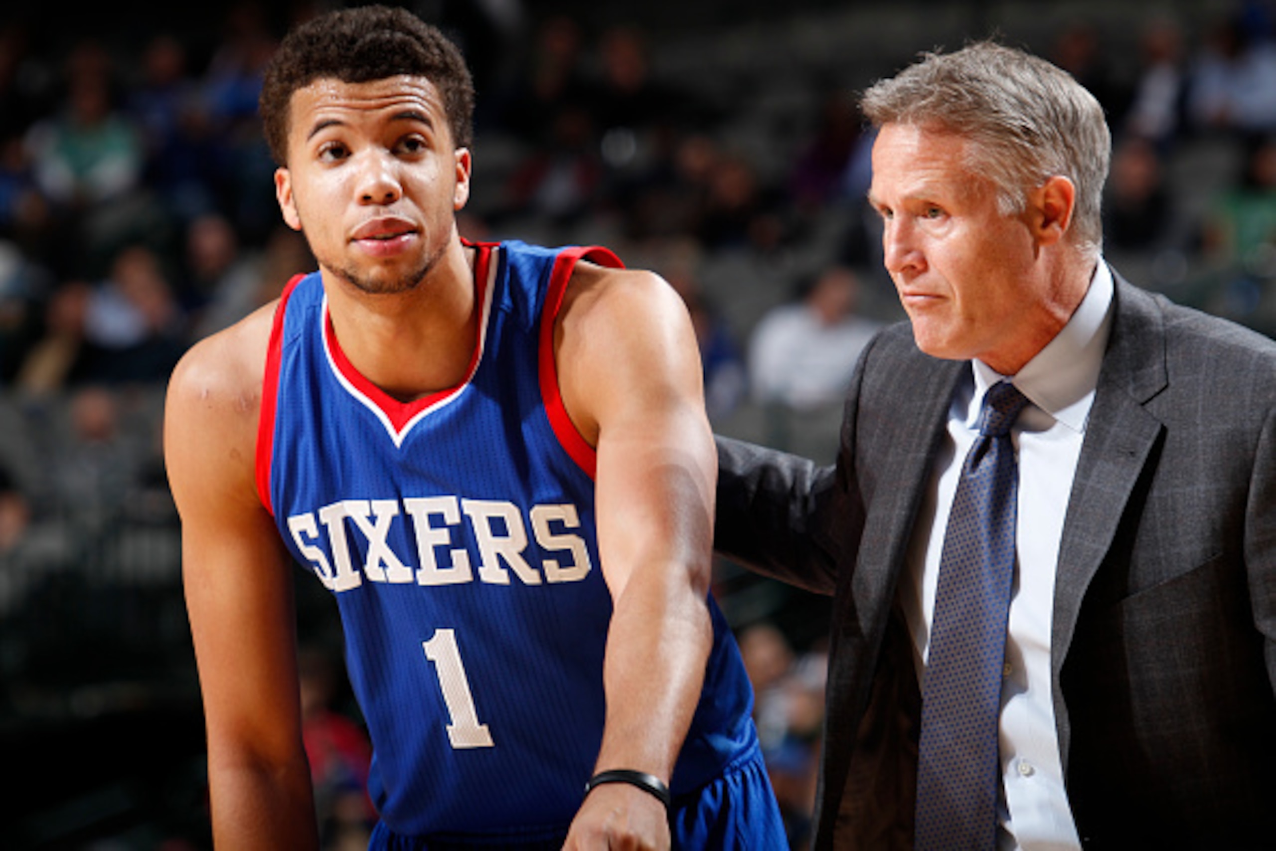 DALLAS, TX - NOVEMBER 13: Michael Carter-Williams #1 of the Philadelphia 76ers gets some words from head coach Brett Brown against the Dallas Mavericks on November 13, 2014 at the American Airlines Center in Dallas, Texas. NOTE TO USER: User expressly ack