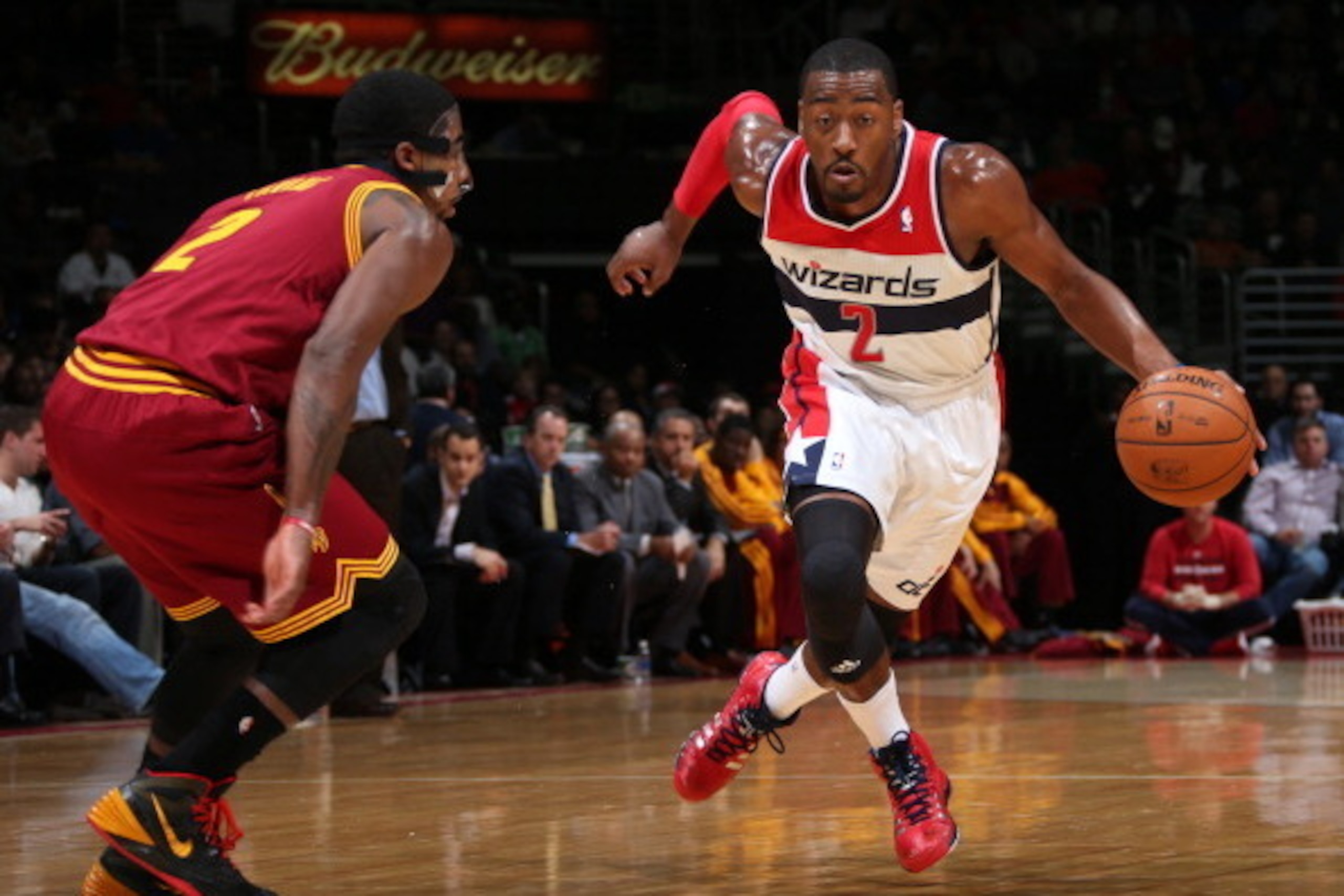 WASHINGTON, DC - NOVEMBER 16: John Wall #2 of the Washington Wizards drives against Kyrie Irving #2 of the Cleveland Cavaliers during the game at the Verizon Center on November 16, 2013 in Washington, DC. NOTE TO USER: User expressly acknowledges and agre