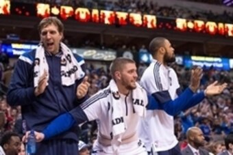Nov 21, 2014; Dallas, TX, USA; Dallas Mavericks forward Dirk Nowitzki (41) and forward Chandler Parsons (25) and center Tyson Chandler (6) celebrate during the second half against the Los Angeles Lakers at the American Airlines Center. The Mavericks defea