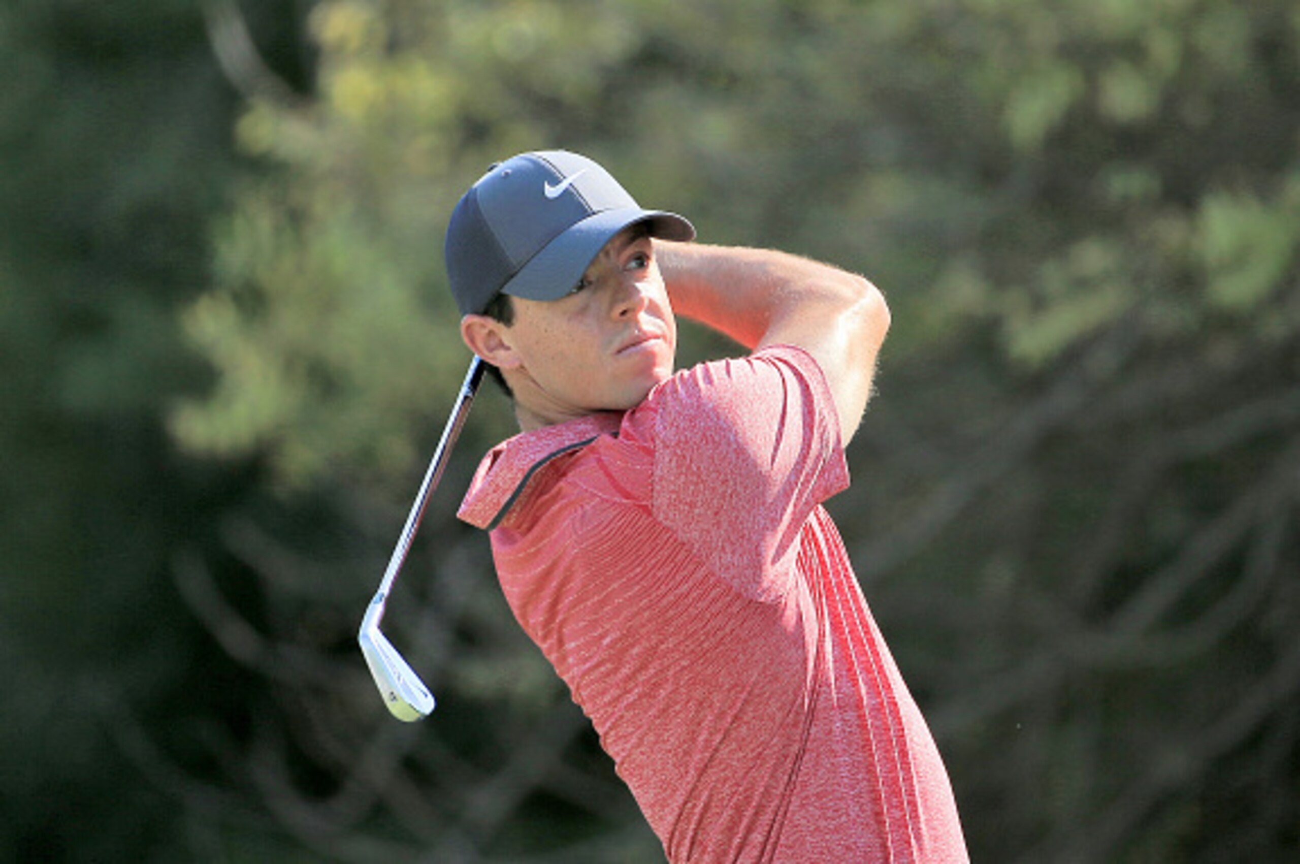 DUBAI, UNITED ARAB EMIRATES - NOVEMBER 22:  Rory McIlroy of Northern Ireland plays his tee shot at the par 3, fourth hole during the third round of the 2014 DP World Tour Championship at Jumeirah Golf Estates on November 22, 2014 in Dubai, United Arab Emi