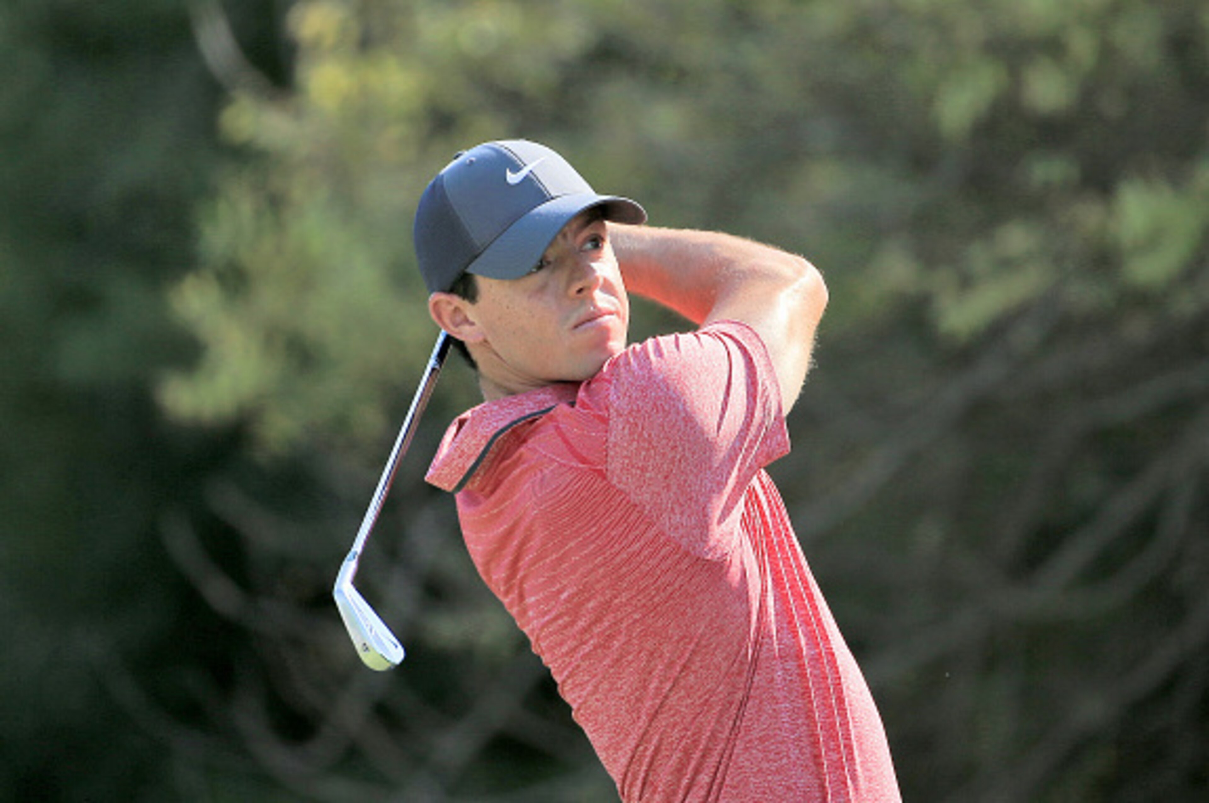 DUBAI, UNITED ARAB EMIRATES - NOVEMBER 22:  Rory McIlroy of Northern Ireland plays his tee shot at the par 3, fourth hole during the third round of the 2014 DP World Tour Championship at Jumeirah Golf Estates on November 22, 2014 in Dubai, United Arab Emi