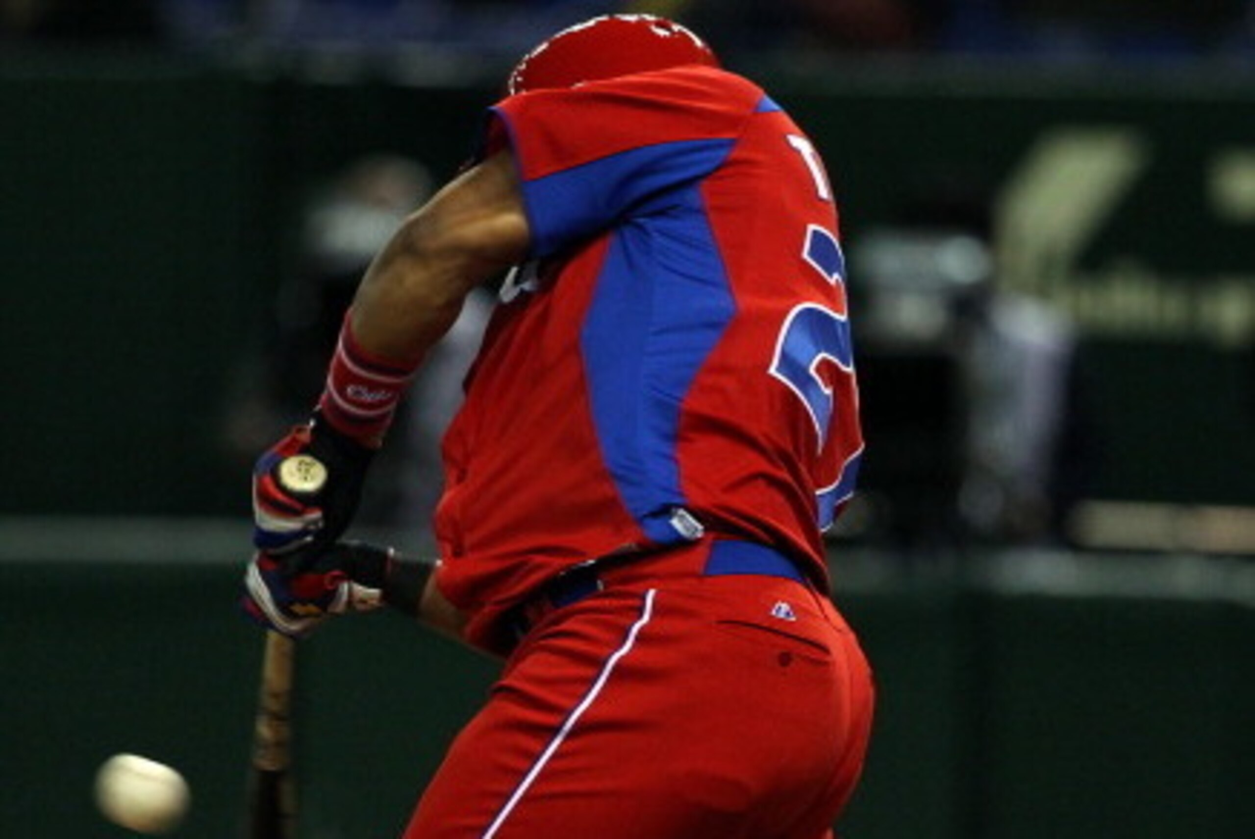 TOKYO, JAPAN - MARCH 11: Outfielder Yasmany Tomas #27 of Cuba hits a sacrifice fly in the top half of the eighth inning during the World Baseball Classic Second Round Pool 1 game between Cuba and the Netherlands at Tokyo Dome on March 11, 2013 in Tokyo, J