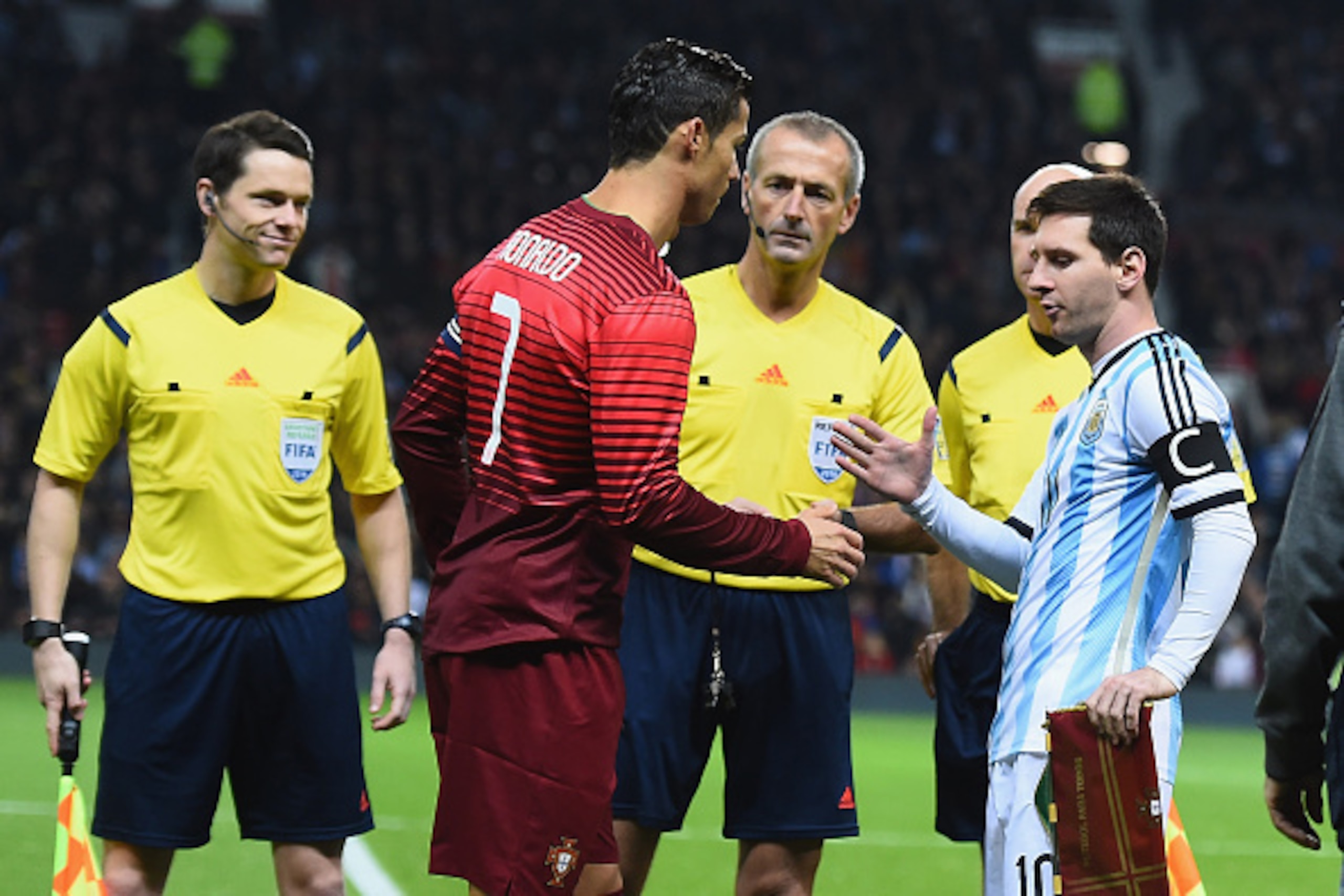 MANCHESTER, ENGLAND - NOVEMBER 18:  Lionel Messi of Argentina shakes hands with Cristiano Ronaldo of Portugal prior to the International Friendly match between Argentina and Portugal at Old Trafford on November 18, 2014 in Manchester, England.  (Photo by 