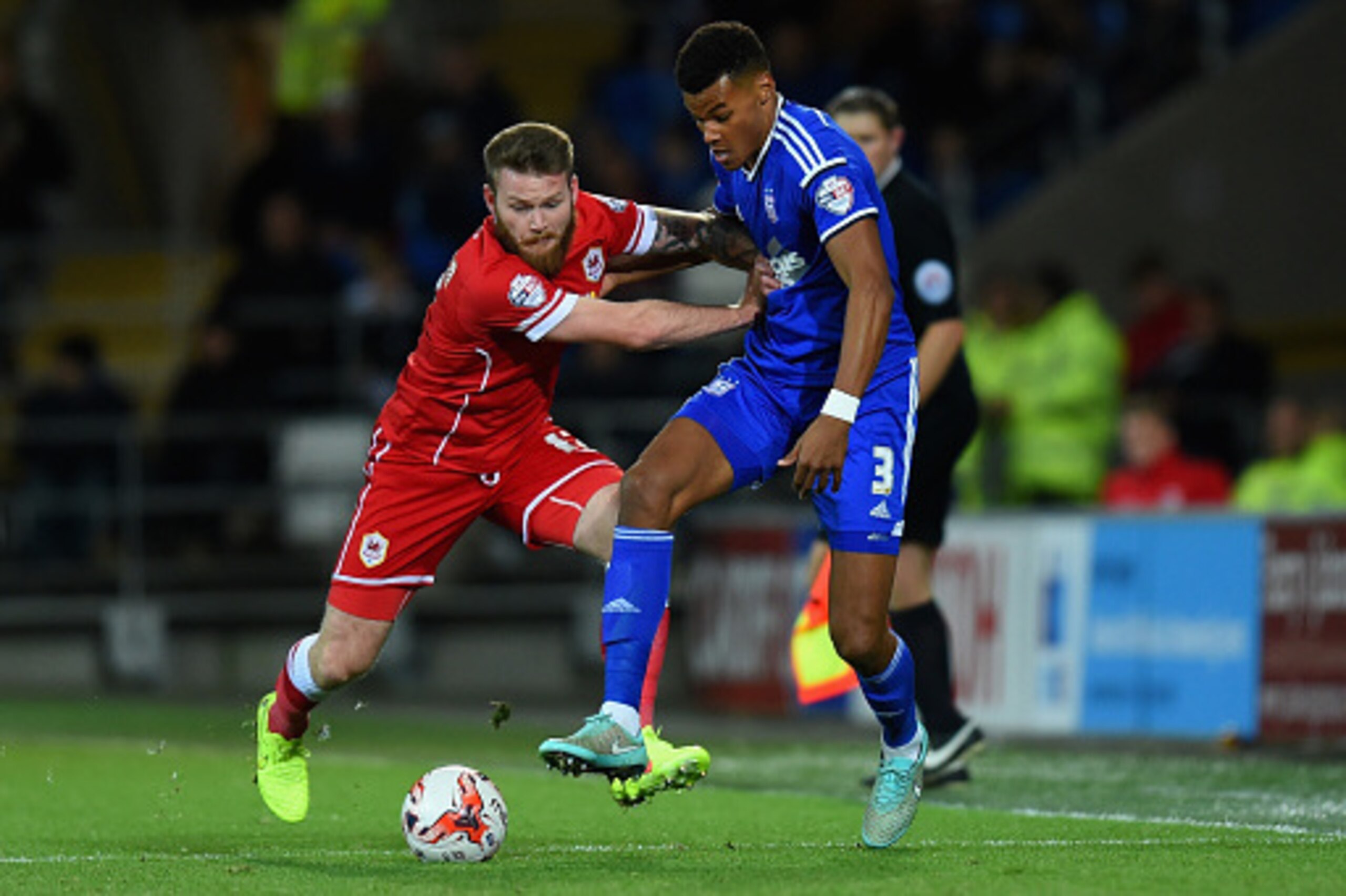CARDIFF, WALES - OCTOBER 21: Ipswich player Tyrone Mings (r) is challenged by Aron Gunnarsson of Cardiff during the Sky Bet Championship match between Cardiff City and Ipswich Town at Cardiff City Stadium on October 21, 2014 in Cardiff, Wales. (Photo by CARDIFF, WALES - OCTOBER 21: Ipswich player Tyrone Mings (r) is challenged by Aron Gunnarsson of Cardiff during the Sky Bet Championship match between Cardiff City and Ipswich Town at Cardiff City Stadium on October 21, 2014 in Cardiff, Wales. (Photo by
