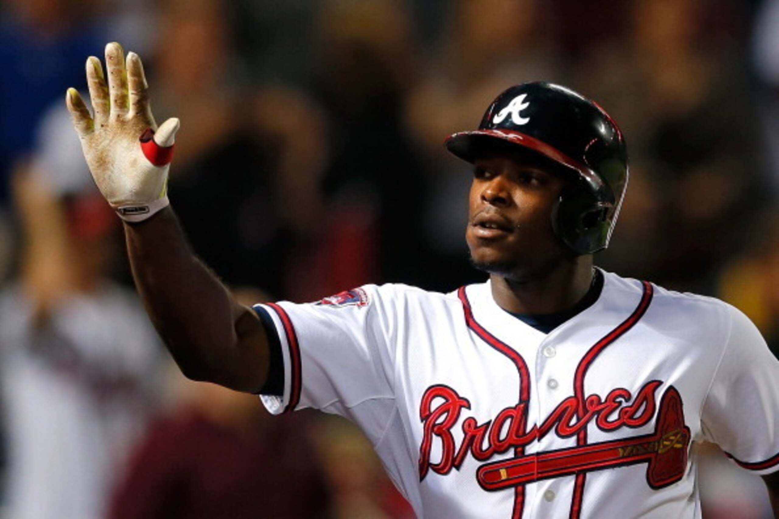 ATLANTA, GA - MAY 19:  Justin Upton #8 of the Atlanta Braves celebrates hitting a two-run homer in the eighth inning against the Milwaukee Brewers that also scored Jason Heyward #22 at Turner Field on May 19, 2014 in Atlanta, Georgia.  (Photo by Kevin C. 