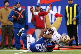 EAST RUTHERFORD, NJ - NOVEMBER 16:    Devon Kennard #59 of the New York Giants sacks Colin Kaepernick #7 of the San Francisco 49ers in the first quarter at MetLife Stadium on November 16, 2014 in East Rutherford, New Jersey.  (Photo by Elsa/Getty Images)