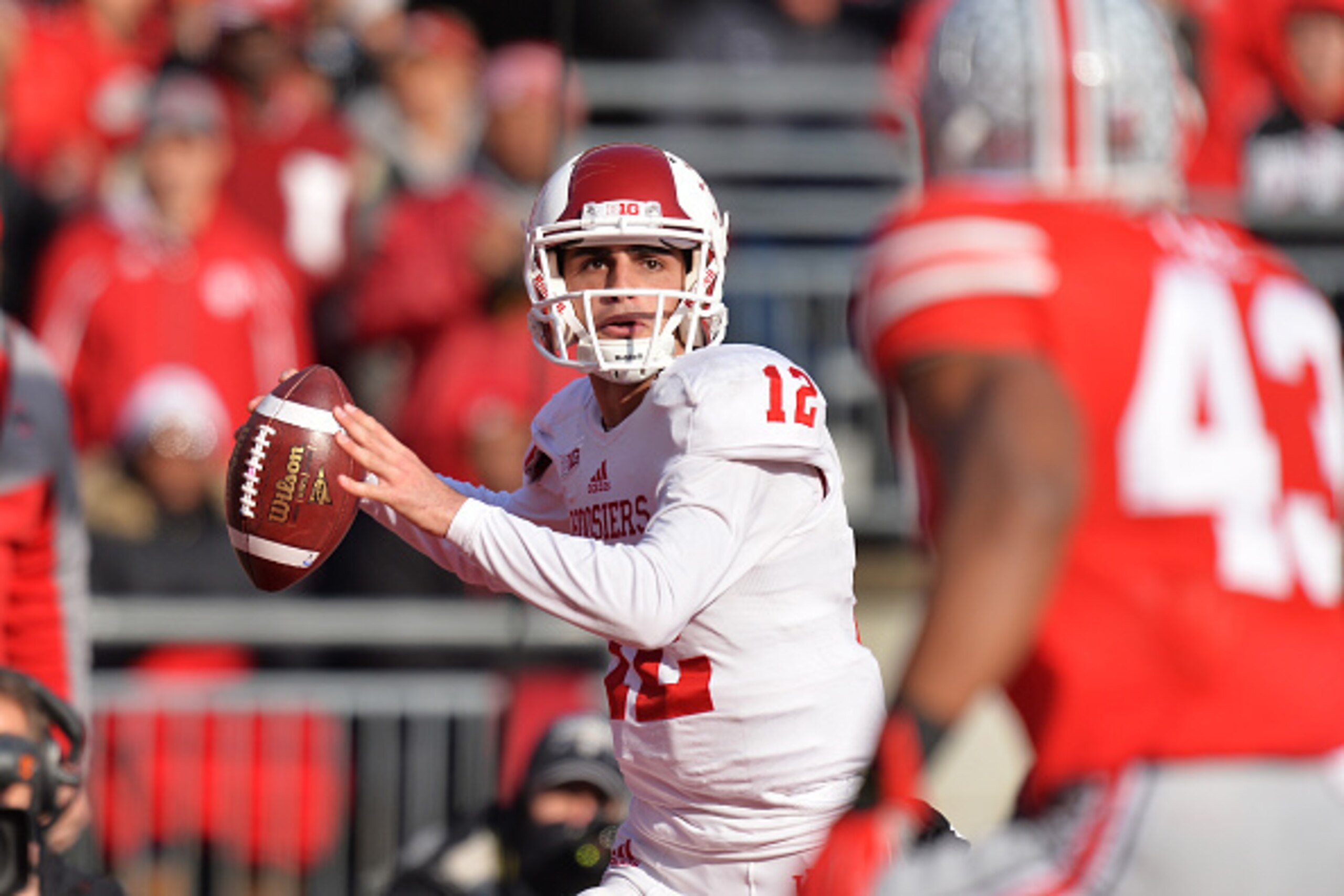 COLUMBUS, OH - NOVEMBER 22:  Quarterback Zander Diamont #12 of the Indiana Hoosiers looks for a receiver in the third quarter against the Ohio State Buckeyes at Ohio Stadium on November 22, 2014 in Columbus, Ohio. Ohio State defeated Indiana 42-27.  (Phot