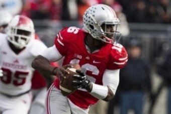 Nov 22, 2014; Columbus, OH, USA; Ohio State Buckeyes quarterback J.T. Barrett (16) looks downfield for an open receiver against the Indiana Hoosiers at Ohio Stadium. Ohio State won the game 42-27. Mandatory Credit: Greg Bartram-USA TODAY Sports