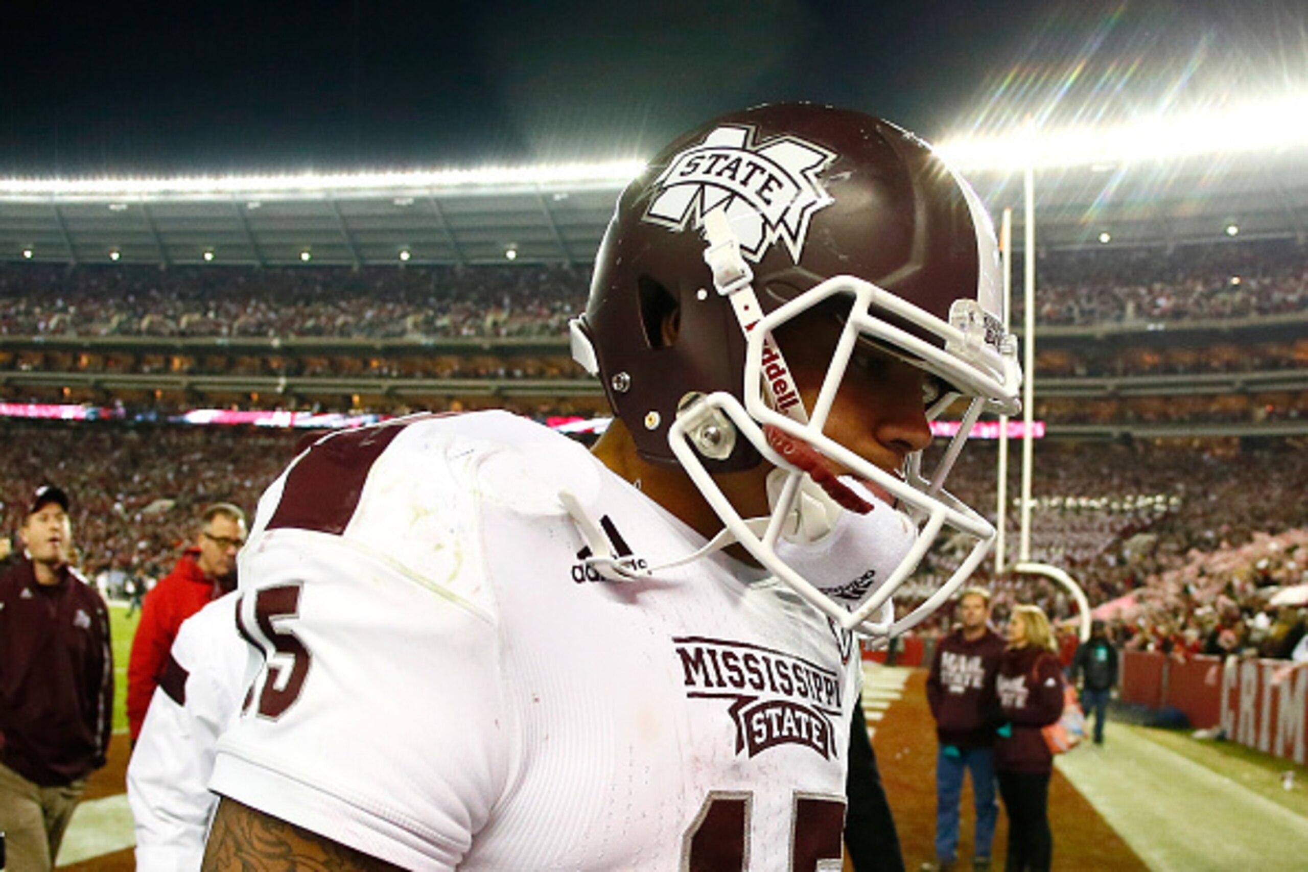 TUSCALOOSA, AL - NOVEMBER 15:  Dak Prescott #15 of the Mississippi State Bulldogs walks off the field after their 25-20 loss to the Alabama Crimson Tide at Bryant-Denny Stadium on November 15, 2014 in Tuscaloosa, Alabama.  (Photo by Kevin C. Cox/Getty Ima