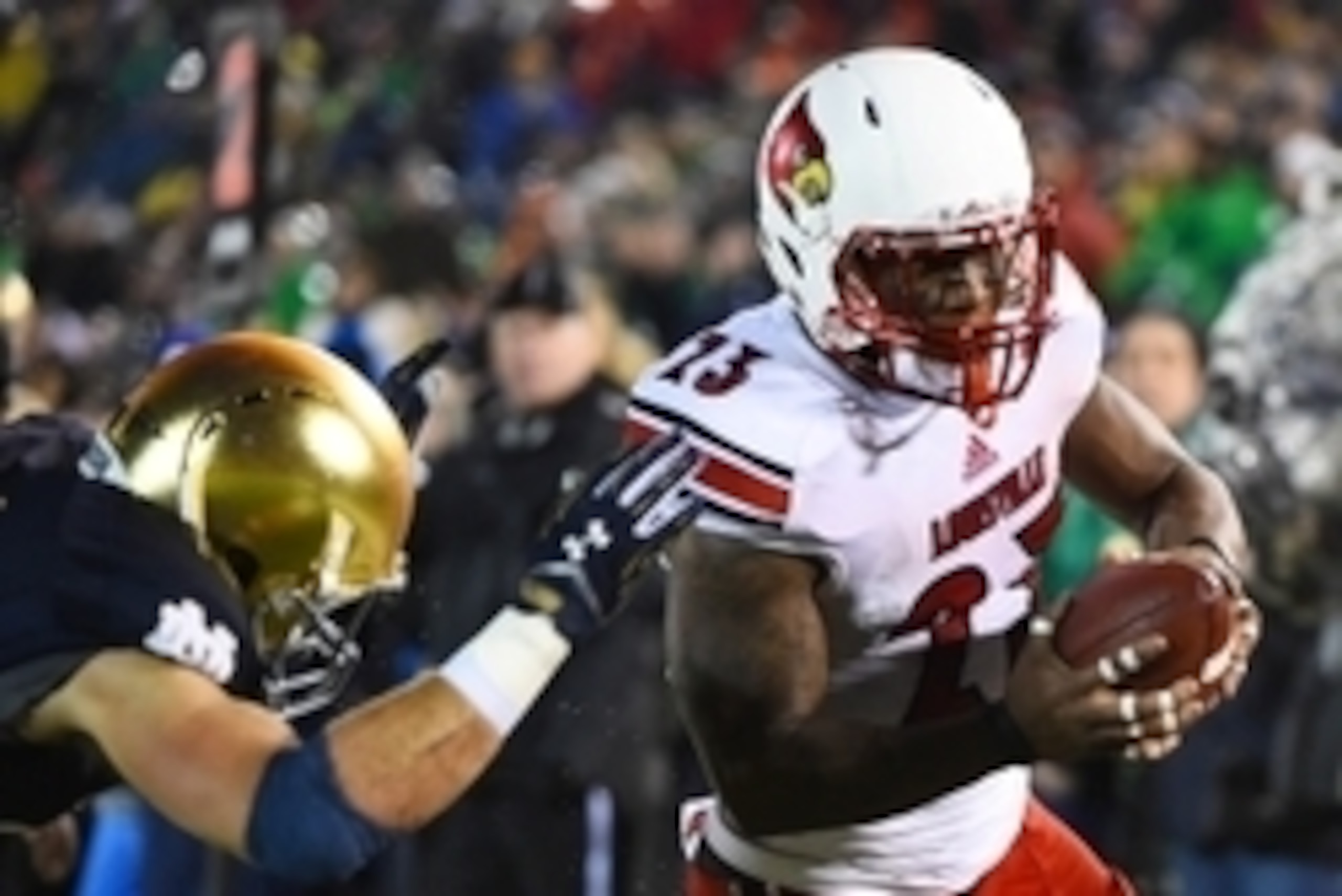 Nov 22, 2014; South Bend, IN, USA; Louisville Cardinals running back Brandon Radcliff (23) scores a touchdown against the Notre Dame Fighting Irish during the fourth quarter at Notre Dame Stadium. The Louisville Cardinals defeat Notre Dame Fighting Irish Nov 22, 2014; South Bend, IN, USA; Louisville Cardinals running back Brandon Radcliff (23) scores a touchdown against the Notre Dame Fighting Irish during the fourth quarter at Notre Dame Stadium. The Louisville Cardinals defeat Notre Dame Fighting Irish
