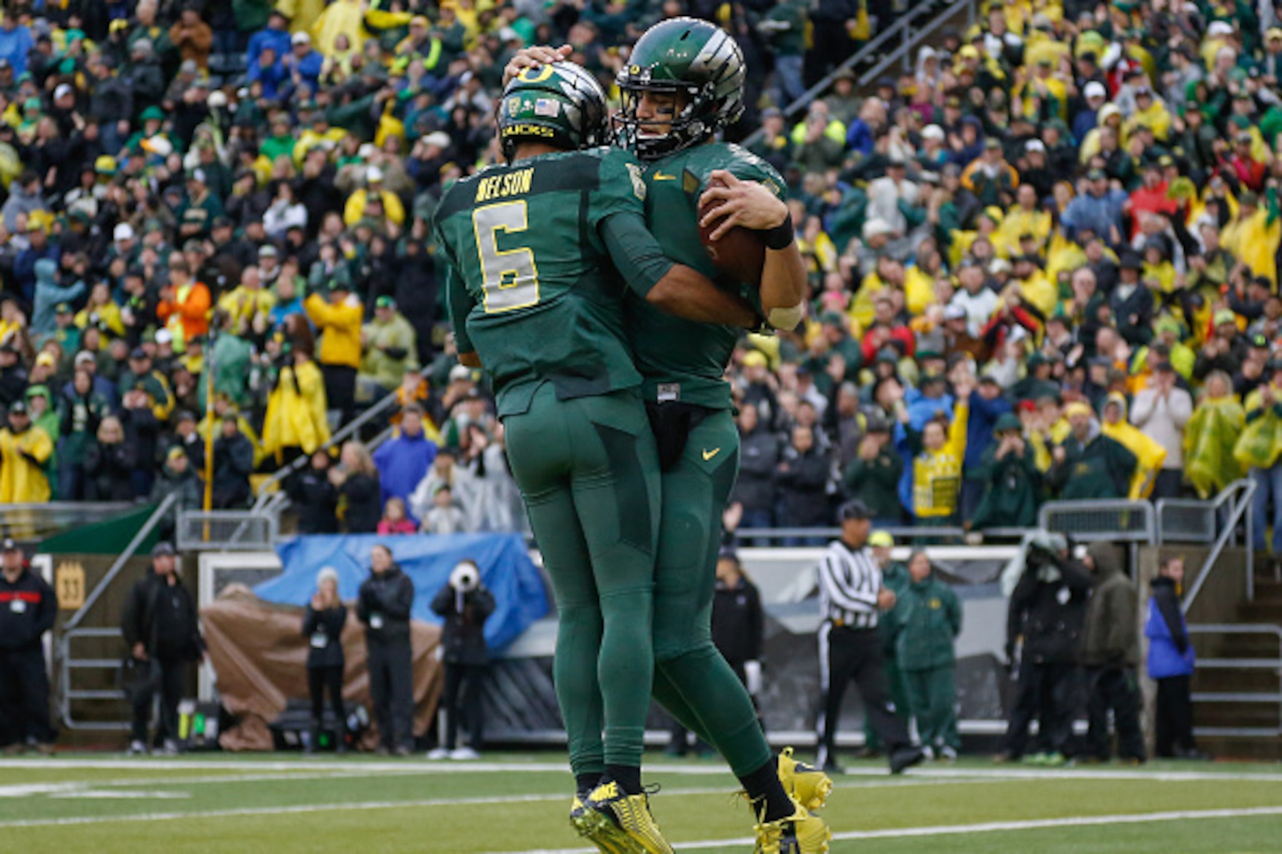 EUGENE, OR - NOVEMBER 22:  Quarterback Marcus Mariota #8 (R) of the Oregon Ducks celebrates with wide receiver Charles Nelson #6 after scoring a touchdown in the first quarter against the Colorado Buffaloes at Autzen Stadium on November 22, 2014 in Eugene