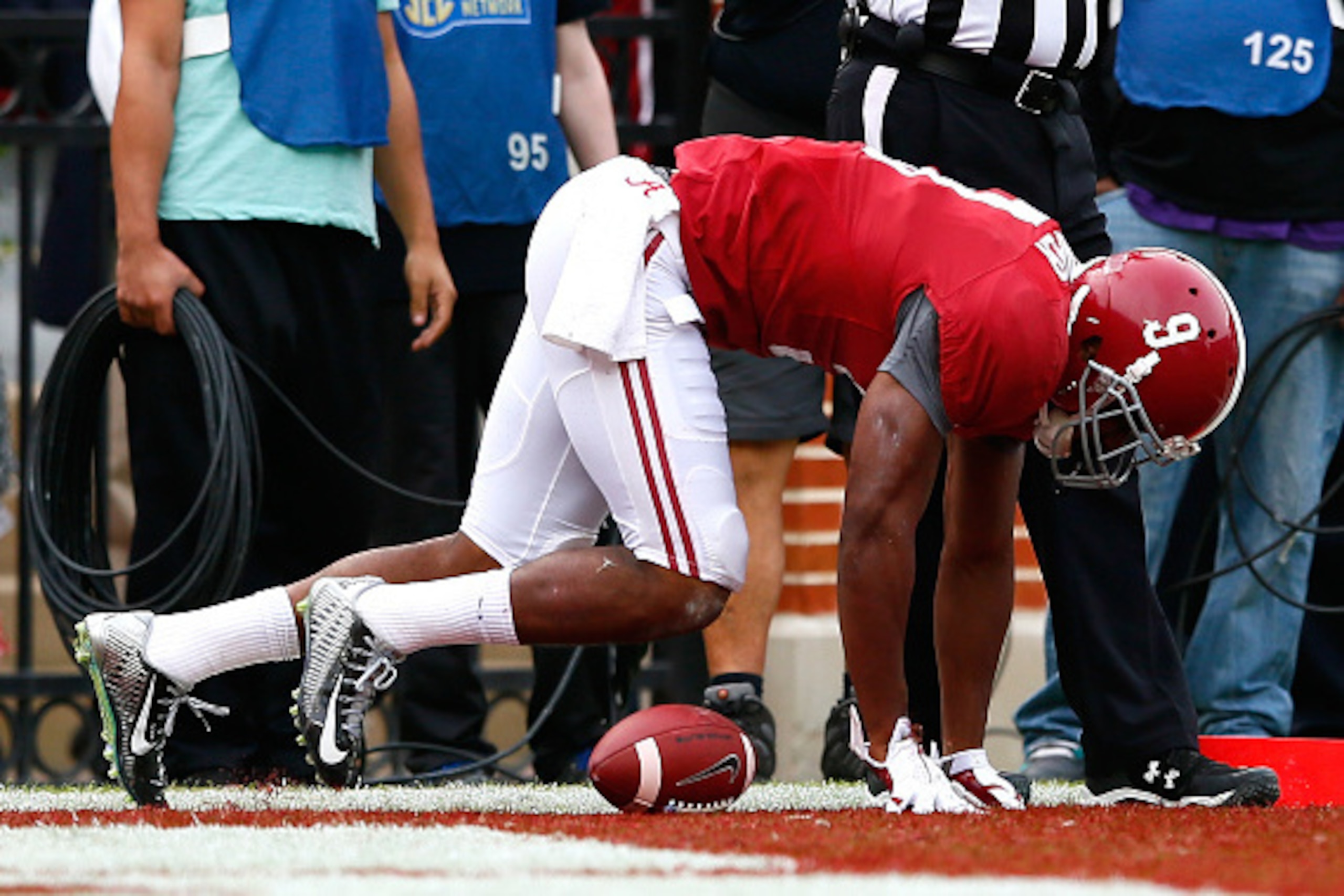 TUSCALOOSA, AL - NOVEMBER 22:  Amari Cooper #9 of the Alabama Crimson Tide is shaken up after a tackle by Trey Morgan #26 of the Western Carolina Catamounts at Bryant-Denny Stadium on November 22, 2014 in Tuscaloosa, Alabama.  (Photo by Kevin C. Cox/Getty