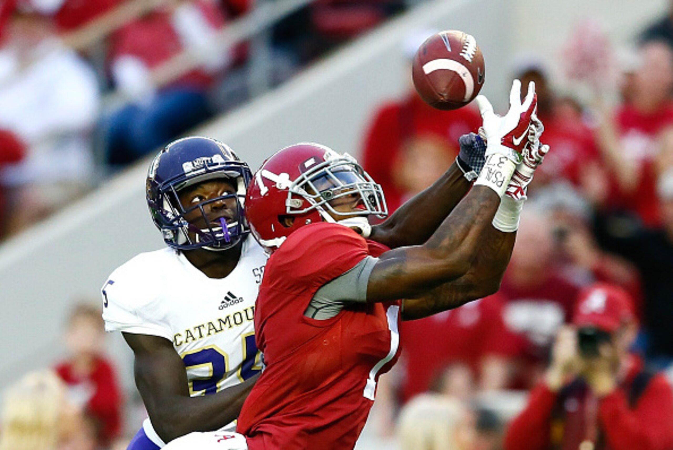 TUSCALOOSA, AL - NOVEMBER 22:  Chris Black #1 of the Alabama Crimson Tide fails to pull in this touchdown reception against Keion Crossen #35 of the Western Carolina Catamounts at Bryant-Denny Stadium on November 22, 2014 in Tuscaloosa, Alabama.  (Photo b