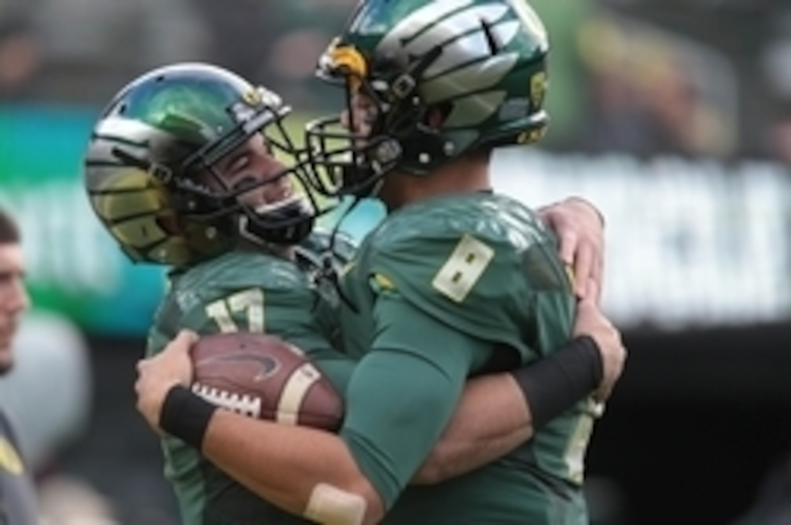 Nov 22, 2014; Eugene, OR, USA; Oregon Ducks quarterback Marcus Mariota (8) and quarterback Jeff Lockie (17) talk before the game against the Colorado Buffaloes at Autzen Stadium. Mandatory Credit: Scott Olmos-USA TODAY Sports