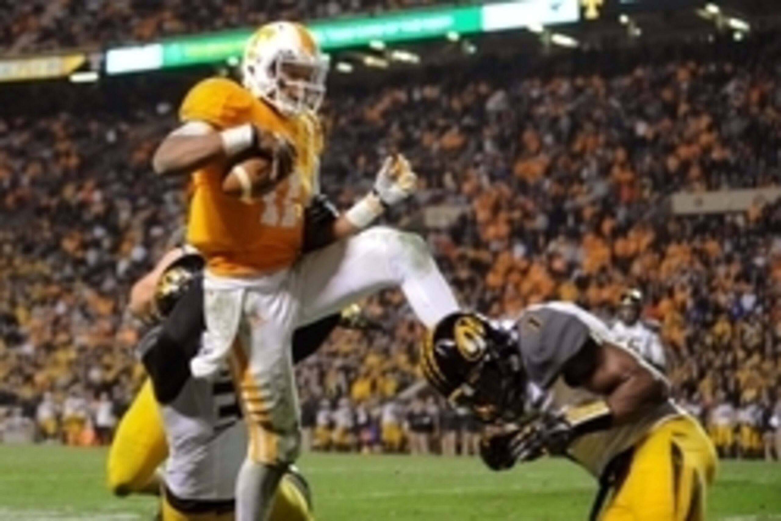 Nov 22, 2014; Knoxville, TN, USA;  Tennessee Volunteers quarterback Joshua Dobbs (11) runs for a two point conversion against the Missouri Tigers during the first quarter at Neyland Stadium. Missouri won 29 to 21. Mandatory Credit: Randy Sartin-USA TODAY 