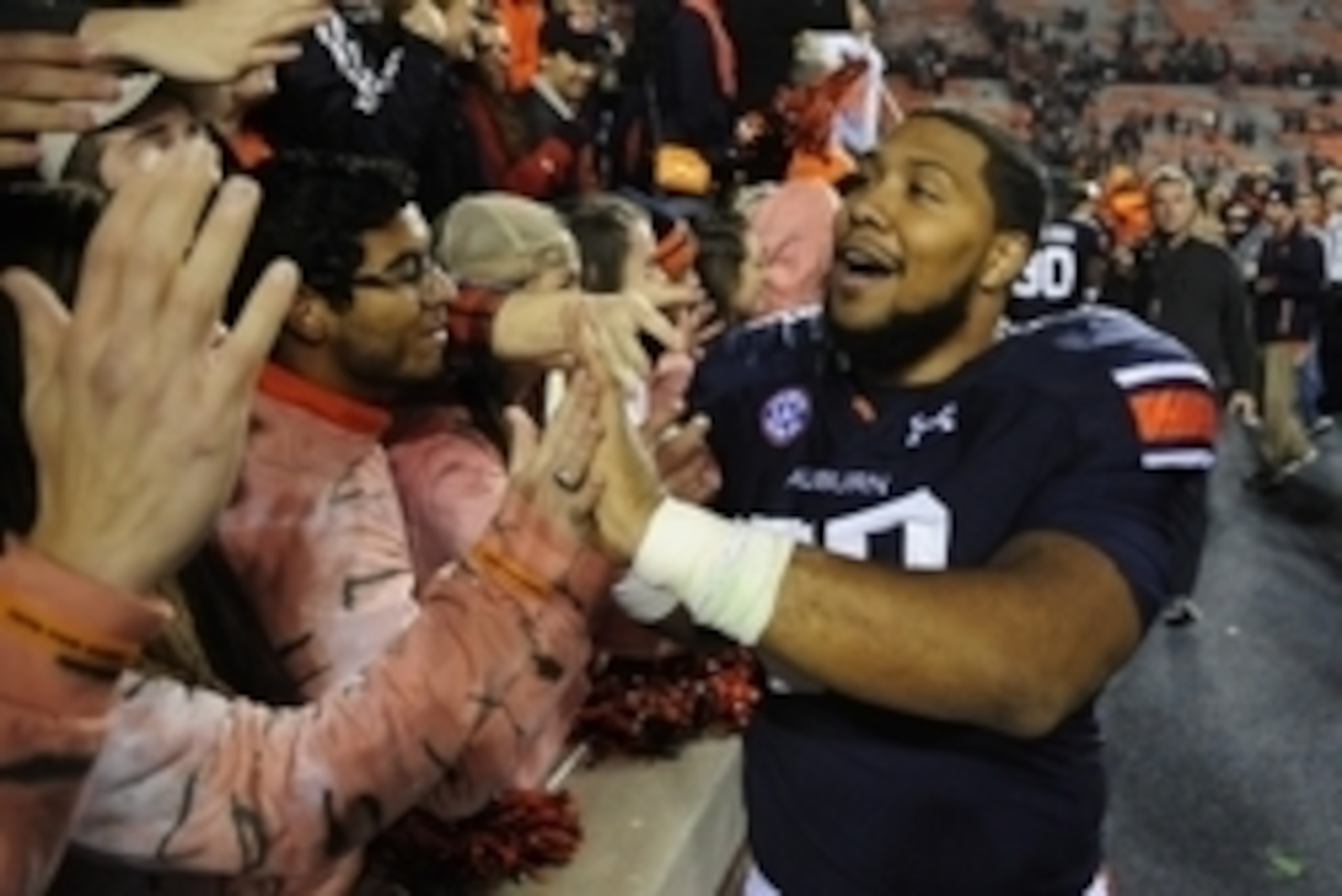 Nov 22, 2014; Auburn, AL, USA; Auburn Tigers defensive lineman Gabe Wright (90) greets fans after the game against the Samford Bulldogs at Jordan Hare Stadium. Auburn won 31-7. Mandatory Credit: Shanna Lockwood-USA TODAY Sports Nov 22, 2014; Auburn, AL, USA; Auburn Tigers defensive lineman Gabe Wright (90) greets fans after the game against the Samford Bulldogs at Jordan Hare Stadium. Auburn won 31-7. Mandatory Credit: Shanna Lockwood-USA TODAY Sports