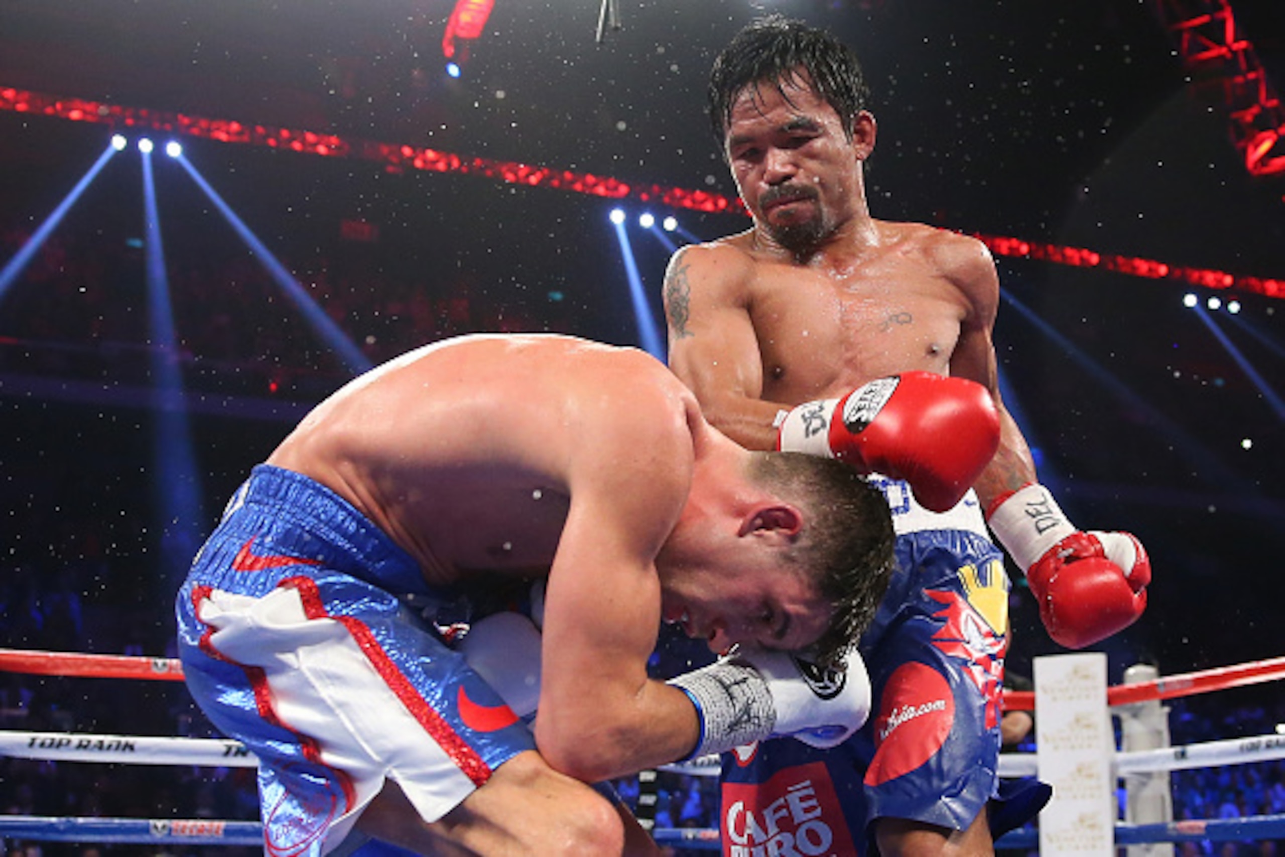 MACAU - NOVEMBER 23:  Manny Pacquiao of the Philippines punches Chris Algieri of the United States during the WBO world welterweight title at The Venetian on November 23, 2014 in Macau, Macau.  (Photo by Chris Hyde/Getty Images)