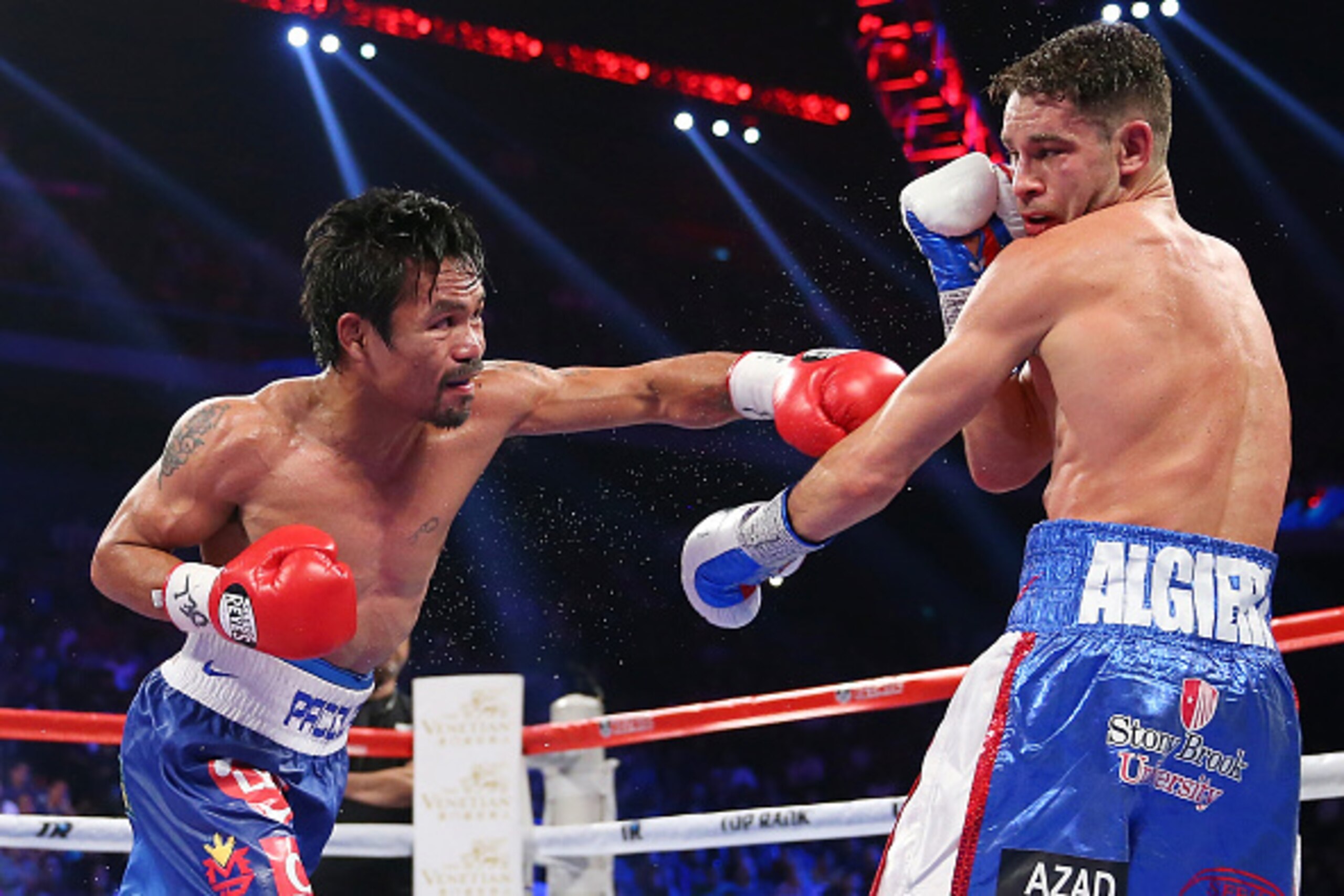 MACAU - NOVEMBER 23:  Manny Pacquiao of the Philippines punches Chris Algieri of the United States during the WBO world welterweight title at The Venetian on November 23, 2014 in Macau, Macau.  (Photo by Chris Hyde/Getty Images)