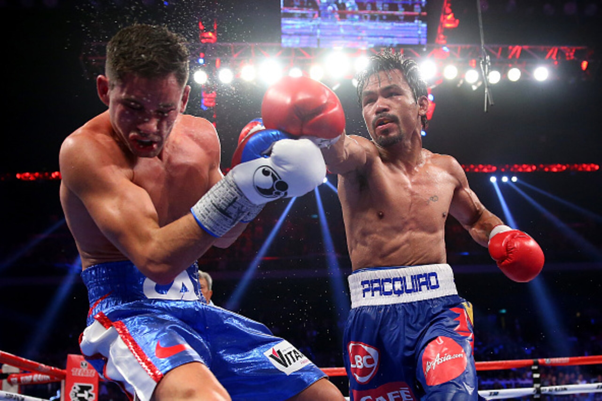 MACAU - NOVEMBER 23:  Manny Pacquiao of the Philippines punches Chris Algieri of the United States during the WBO world welterweight title at The Venetian on November 23, 2014 in Macau, Macau.  (Photo by Chris Hyde/Getty Images)