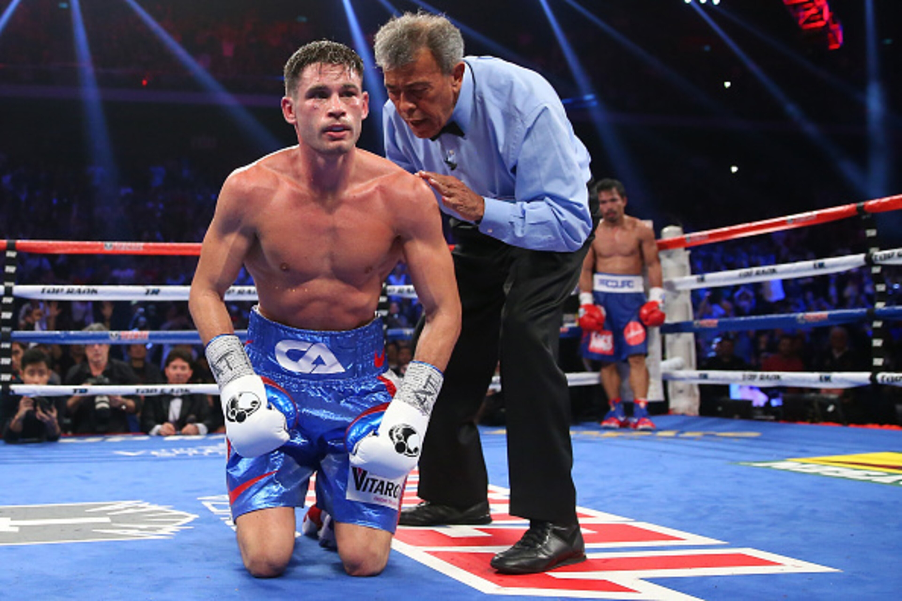 MACAU - NOVEMBER 23:  Manny Pacquiao of the Philippines knockes down Chris Algieri of the United States during the world welterweight title at The Venetian on November 23, 2014 in Macau, Macau.  (Photo by Chris Hyde/Getty Images)