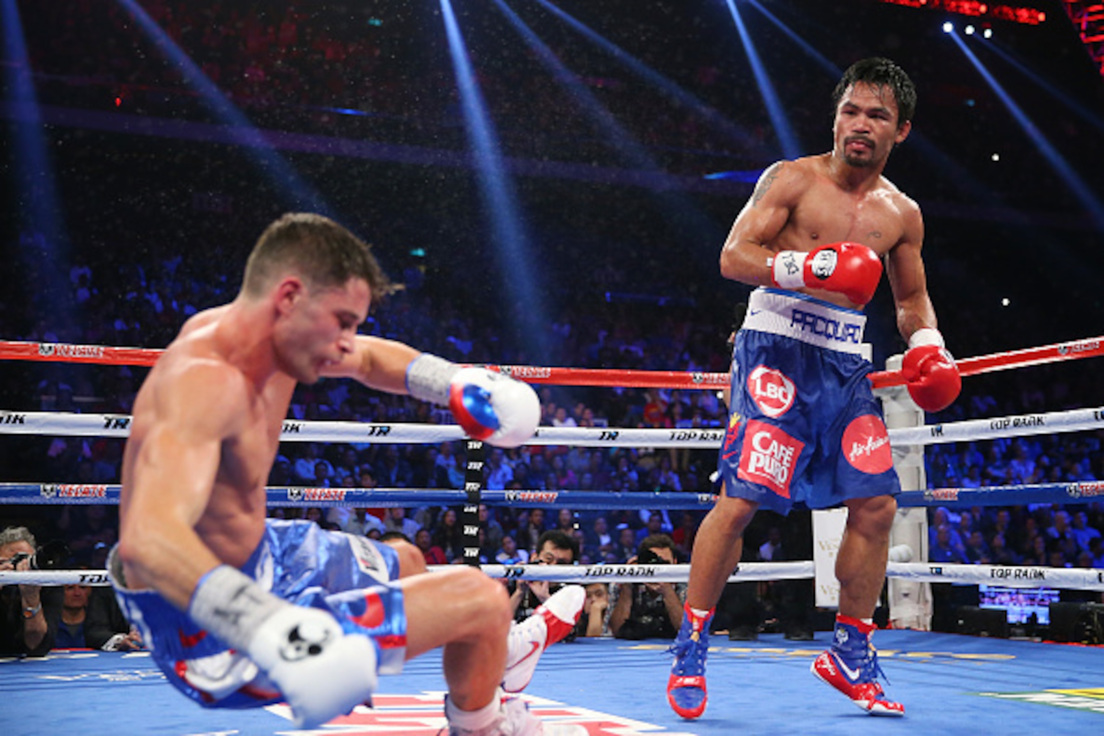 MACAU - NOVEMBER 23:  Manny Pacquiao of the Philippines knockes down Chris Algieri of the United States during the world welterweight title at The Venetian on November 23, 2014 in Macau, Macau.  (Photo by Chris Hyde/Getty Images)