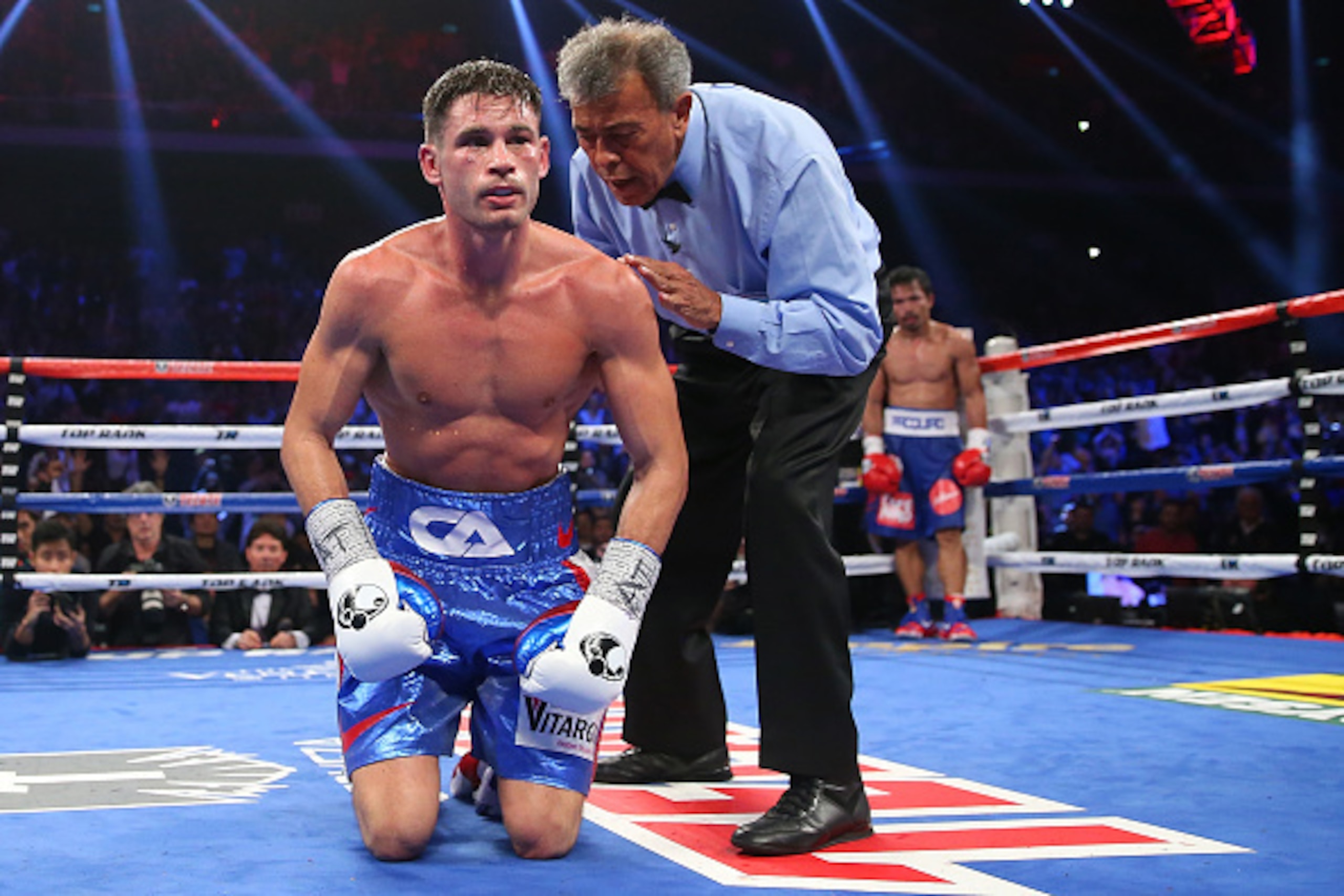 MACAU - NOVEMBER 23:  Manny Pacquiao of the Philippines knockes down Chris Algieri of the United States during the world welterweight title at The Venetian on November 23, 2014 in Macau, Macau.  (Photo by Chris Hyde/Getty Images)