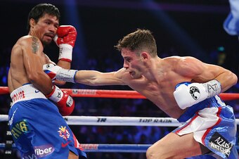 MACAU - NOVEMBER 23:  Chris Algieri of the United States punches Manny Pacquiao of the Philippines during the WBO world welterweight title at The Venetian on November 23, 2014 in Macau, Macau.  (Photo by Chris Hyde/Getty Images)