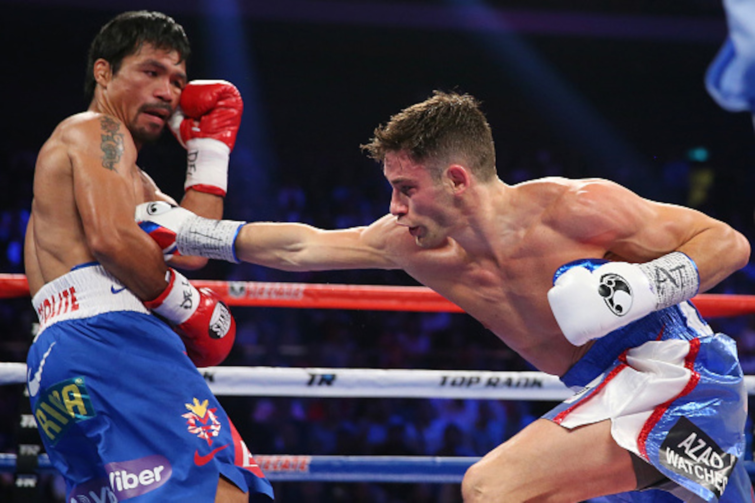 MACAU - NOVEMBER 23:  Chris Algieri of the United States punches Manny Pacquiao of the Philippines during the WBO world welterweight title at The Venetian on November 23, 2014 in Macau, Macau.  (Photo by Chris Hyde/Getty Images)